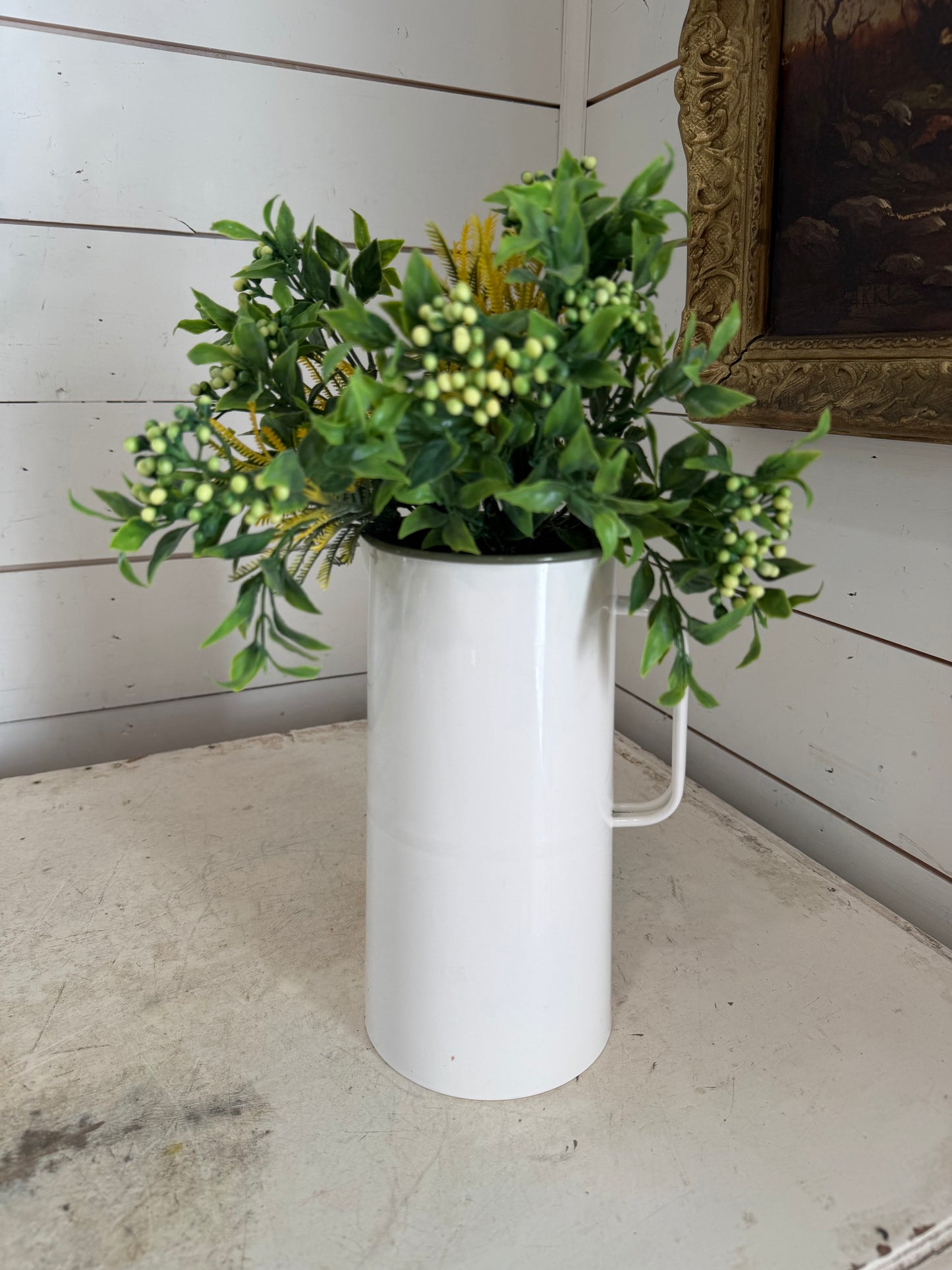 Enamel pitcher with greenery