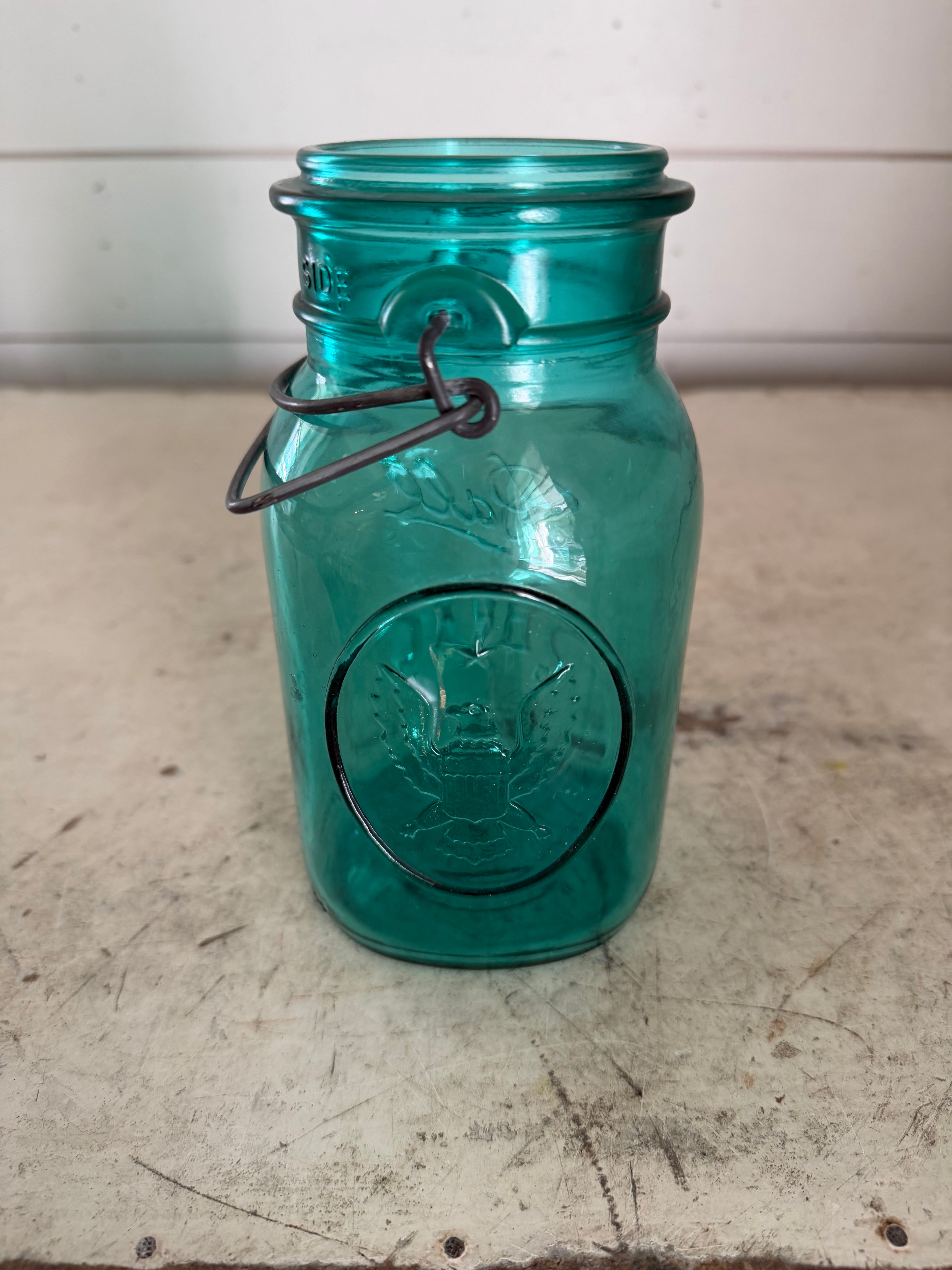 Vintage teal-blue glass Ball Ideal Mason jar With American Eagle Emblem (missing lid)