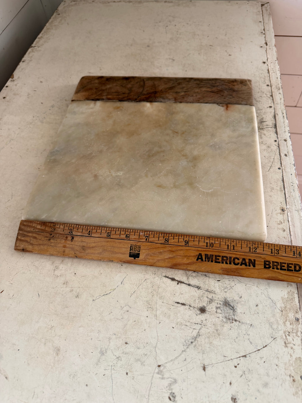 Square marble and wood charcuterie board