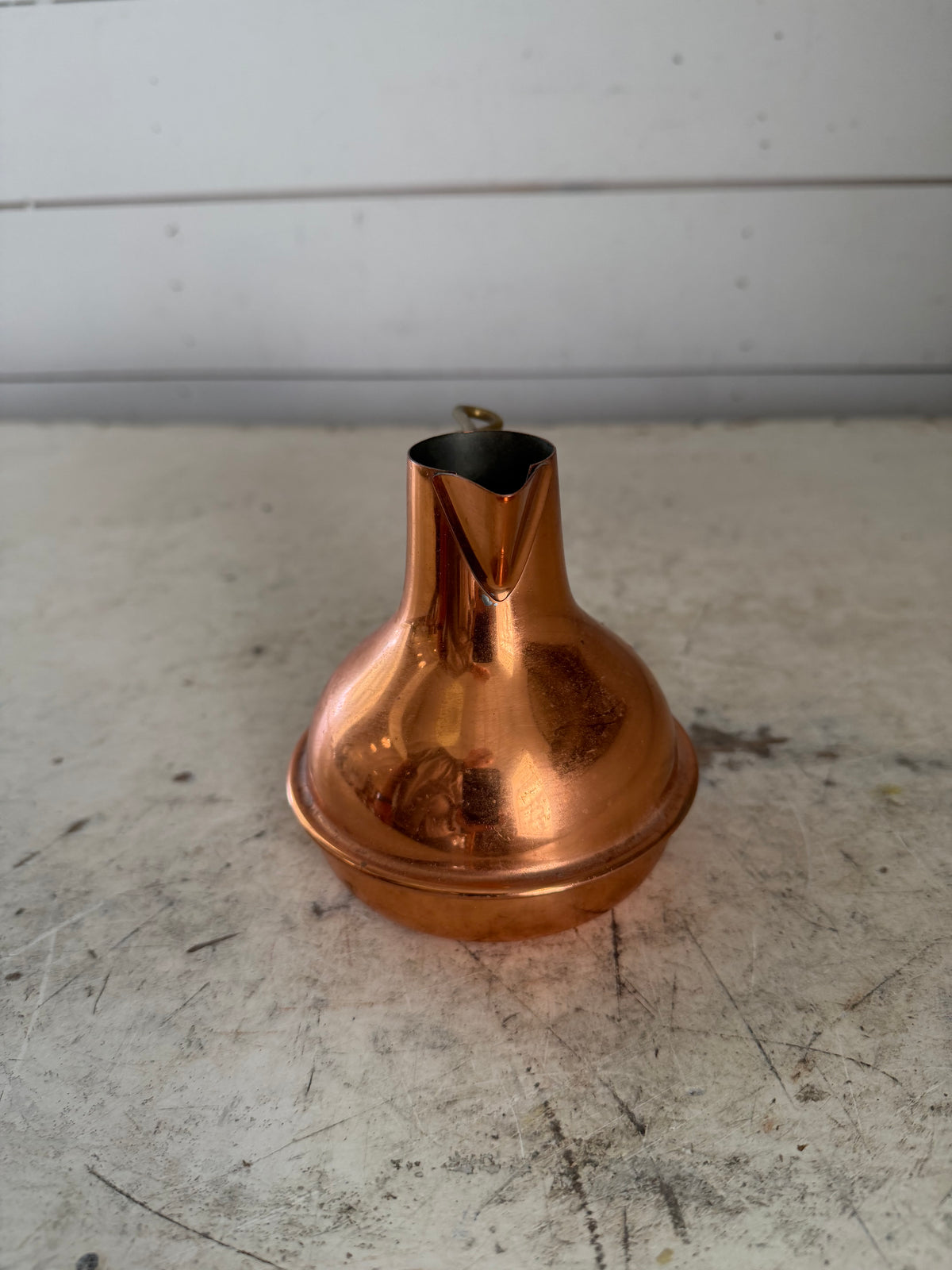 Vintage small copper pitcher with twisted brass handle