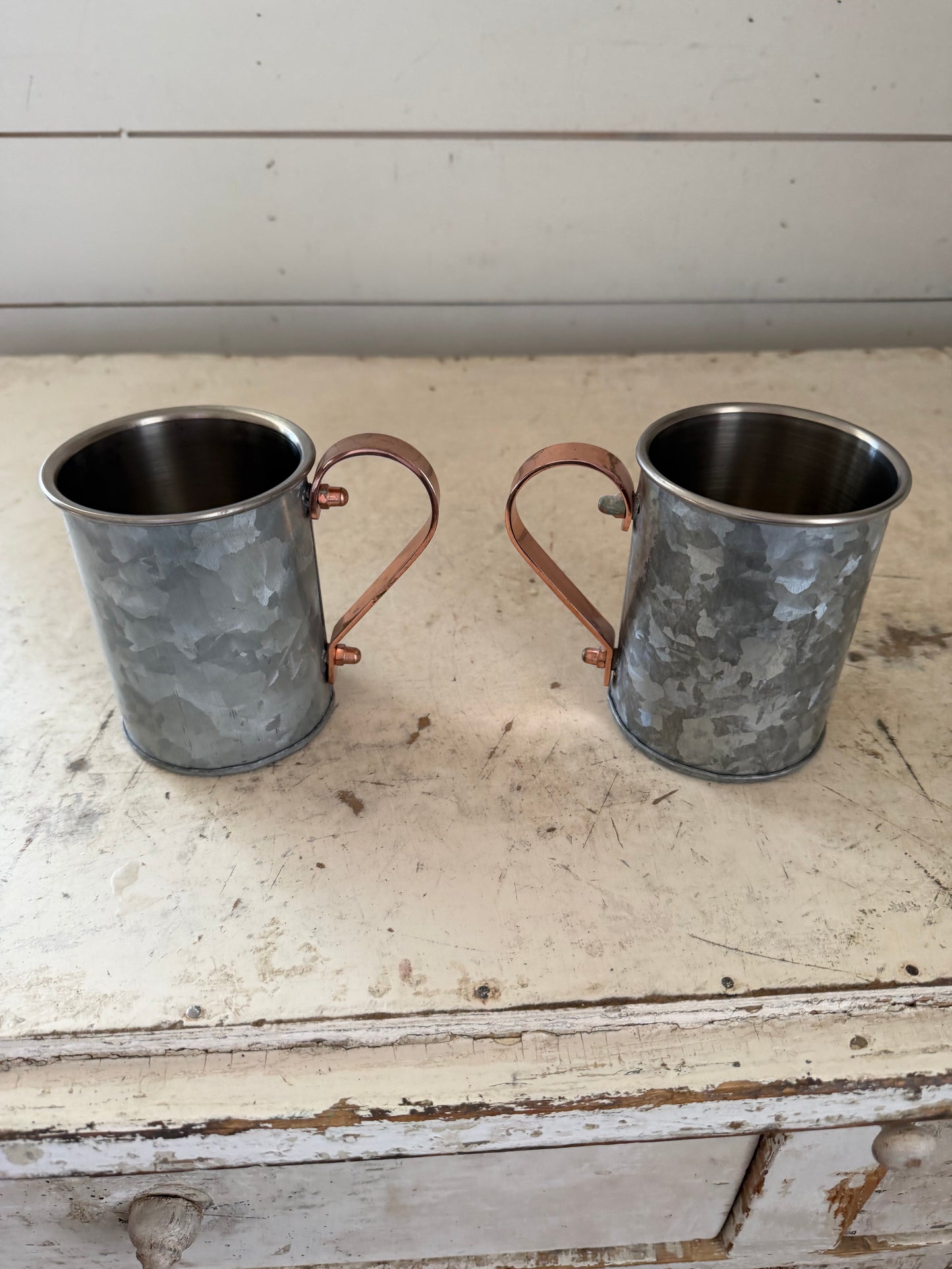 Weighted cup with copper handle