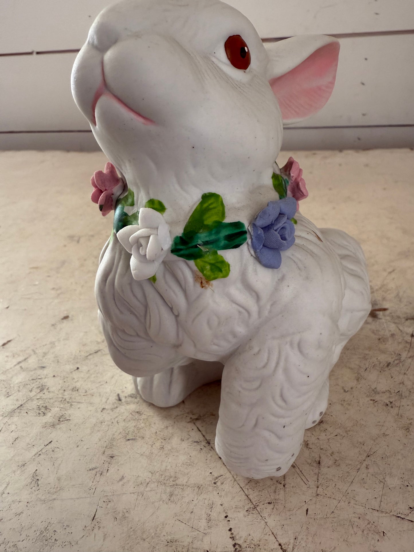 Vintage white rabbit statue with floral wreath  flowers have some chips