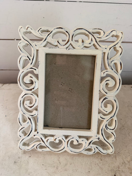 White Scroll Frame will get at