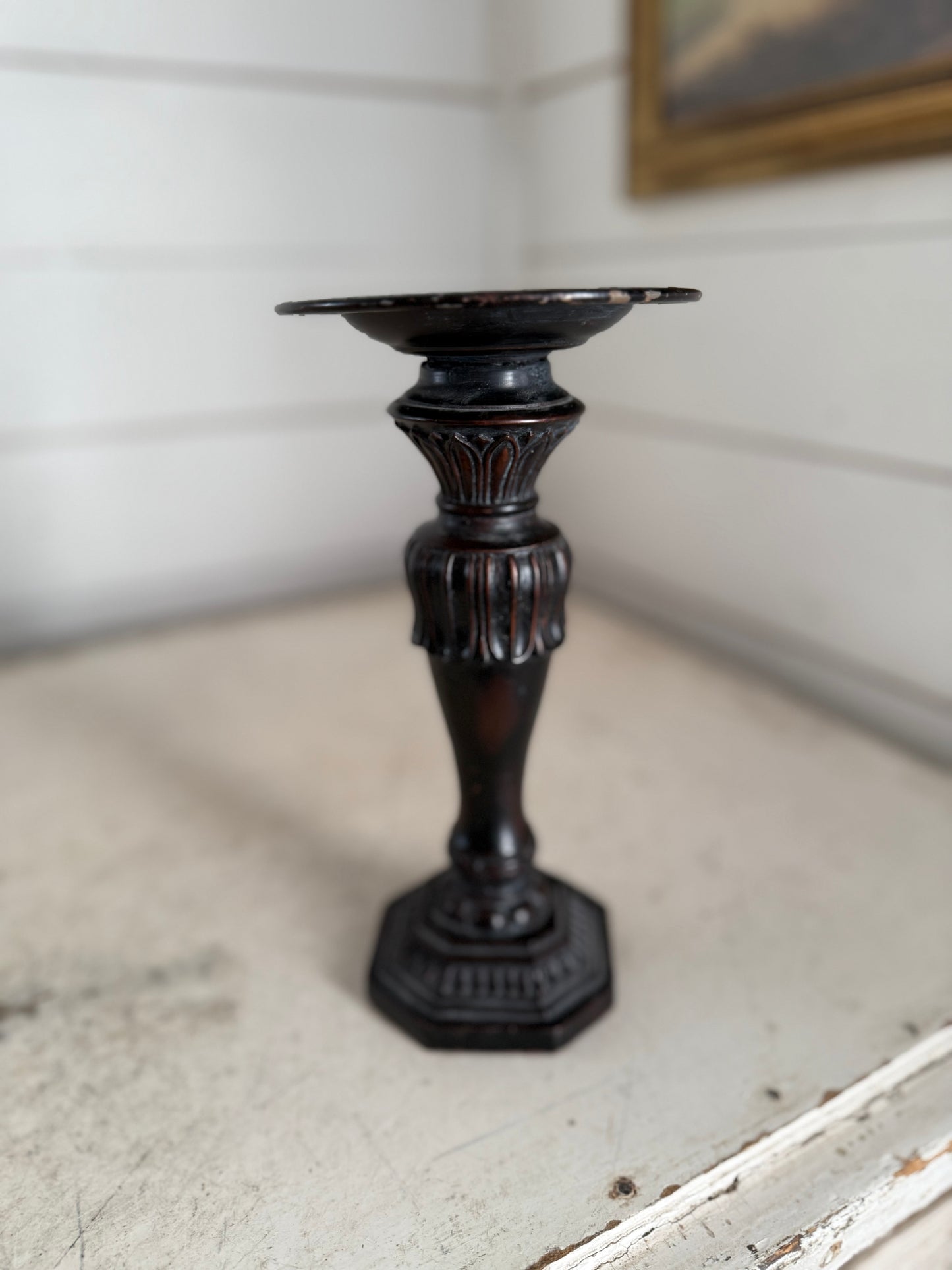 Black ornate candlestick will be painted