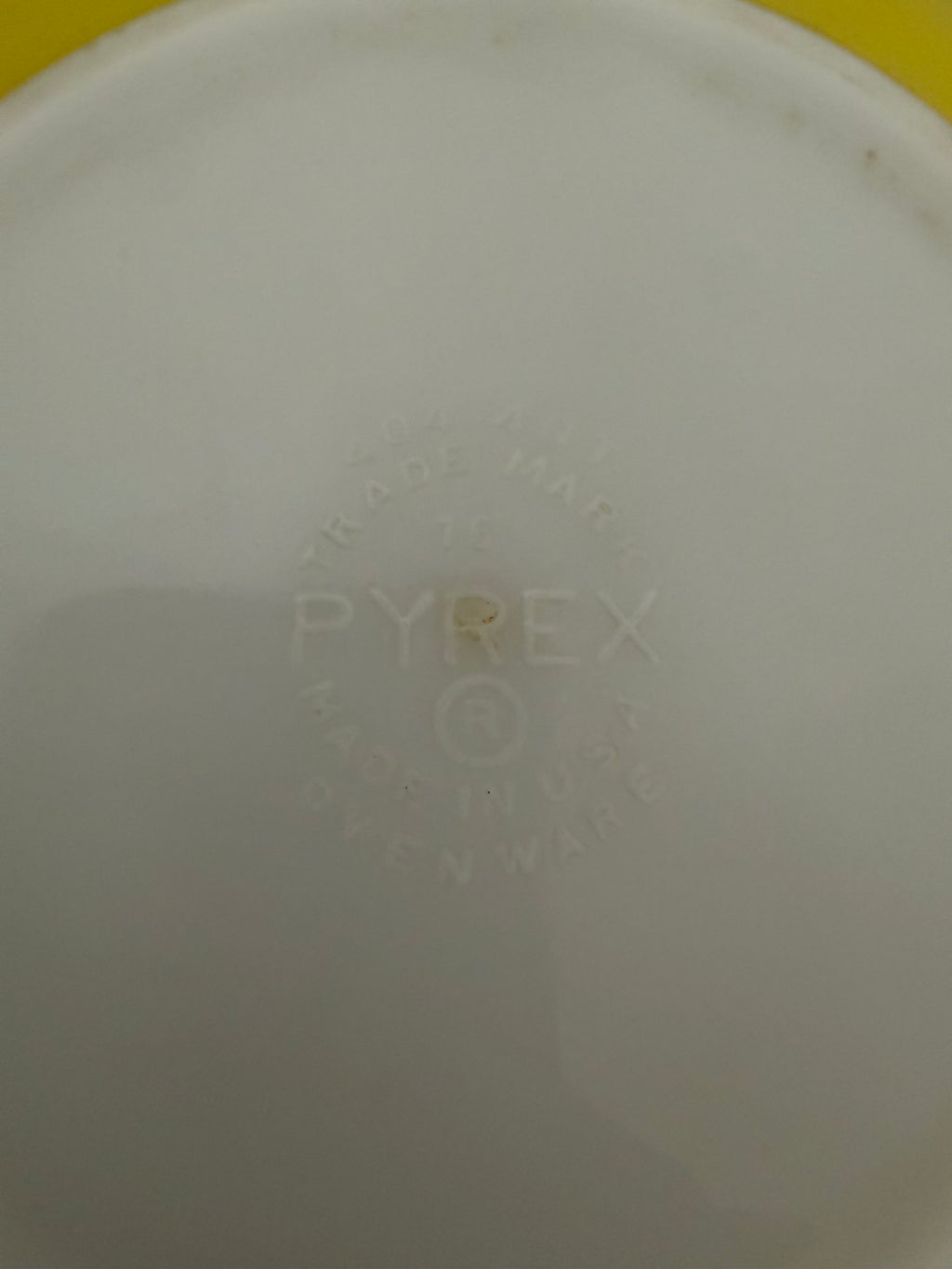 Vintage yellow Pyrex Mixing Bowl with a white interior - Has Some Wear
