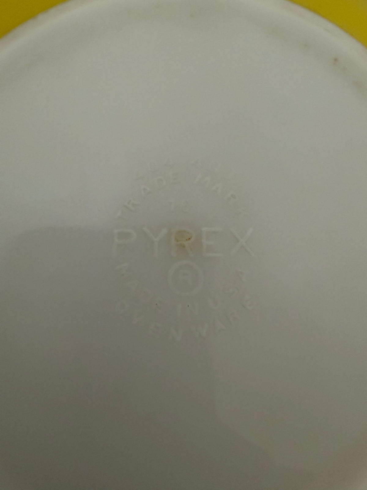 Vintage yellow Pyrex Mixing Bowl with a white interior - Has Some Wear