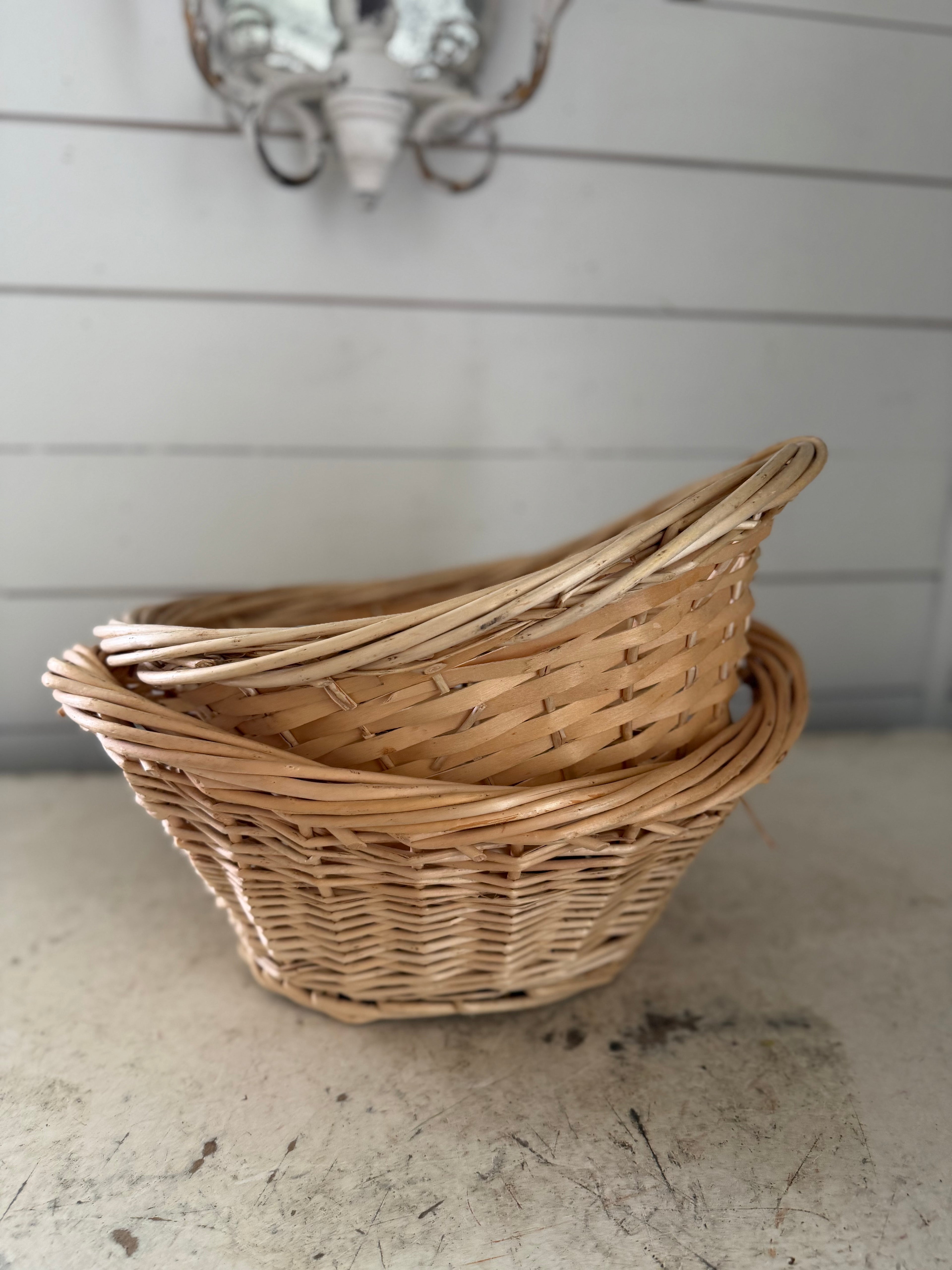 Set of small French style laundry baskets