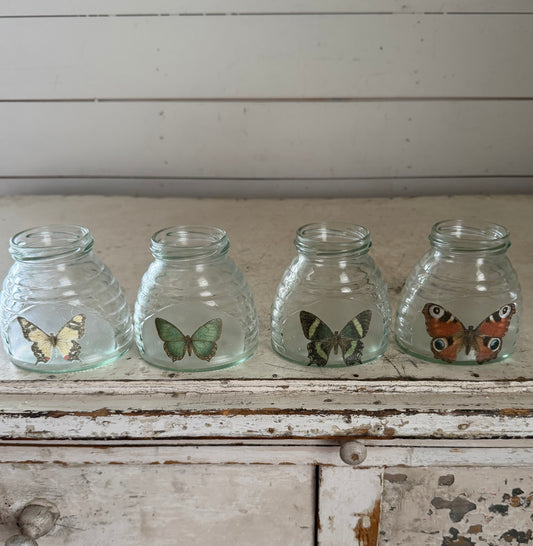 Small green glass jars with beehive theme and decoupaged butterflies  Set of 4