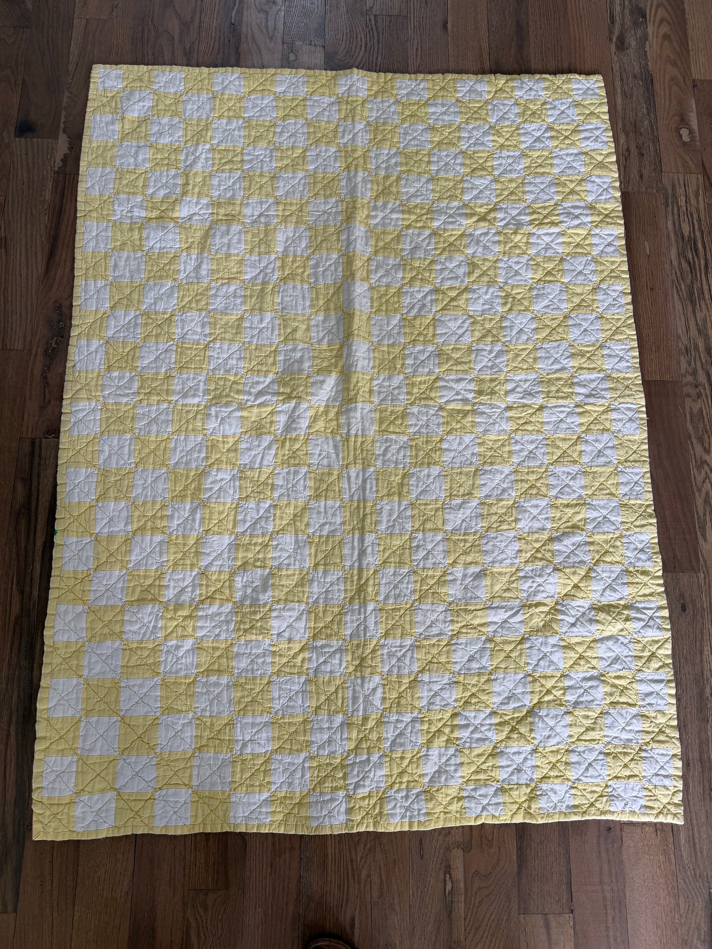 Vintage handmade yellow and white checkerboard quilt throw
