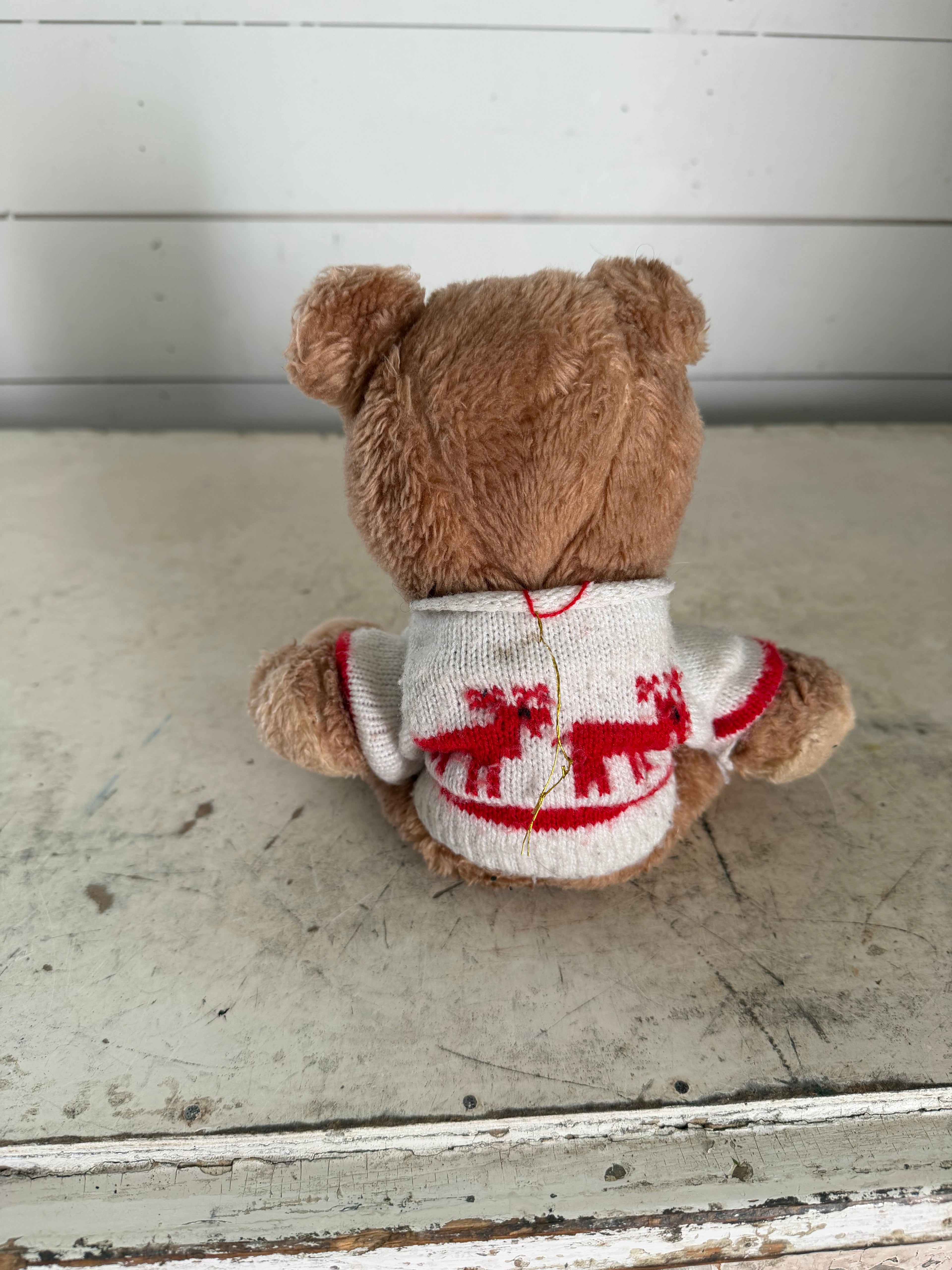 Vintage teddy bear with reindeer sweater