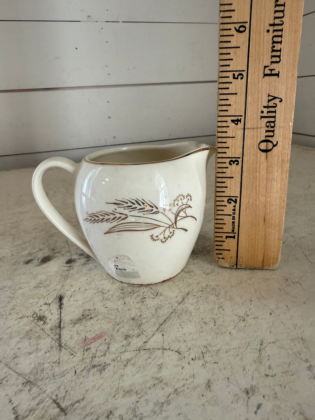 Homer Laughlin mid-century wheat design creamer has some chips