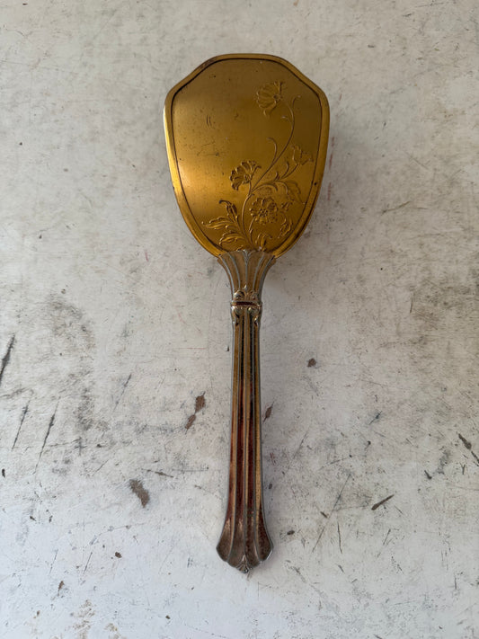 Vintage gold tone hair brush