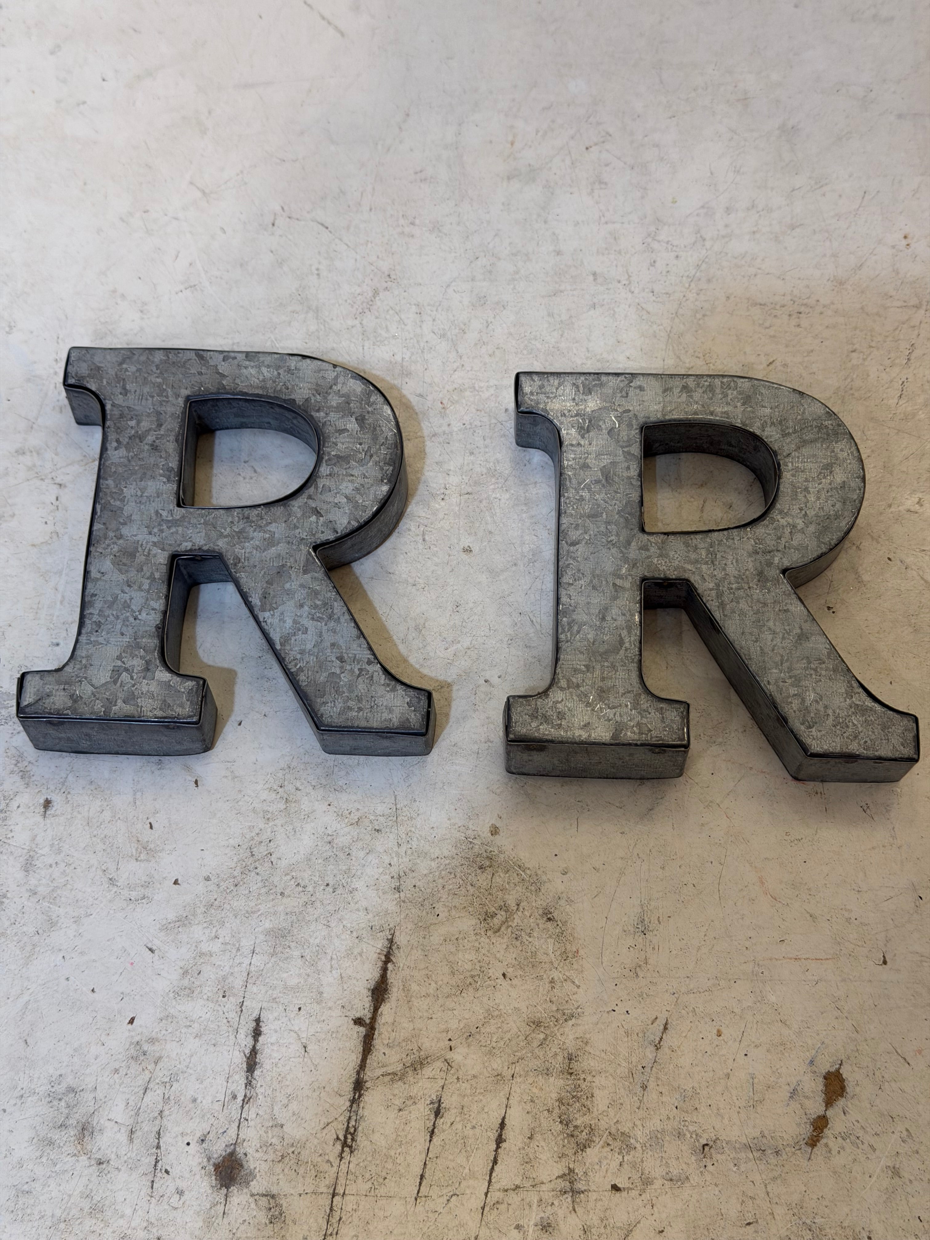 Rustic galvanized, tin letters sold individually Rusted galvanized, tin letters sold individually 3-3/4” - hanging hardware on back