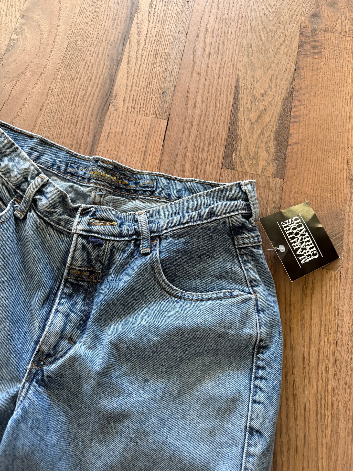 90’s vintage Marithé + François Girbaud denim jeans featuring a black brand hangtag on light-wash material 32 cowboy jean new with tag