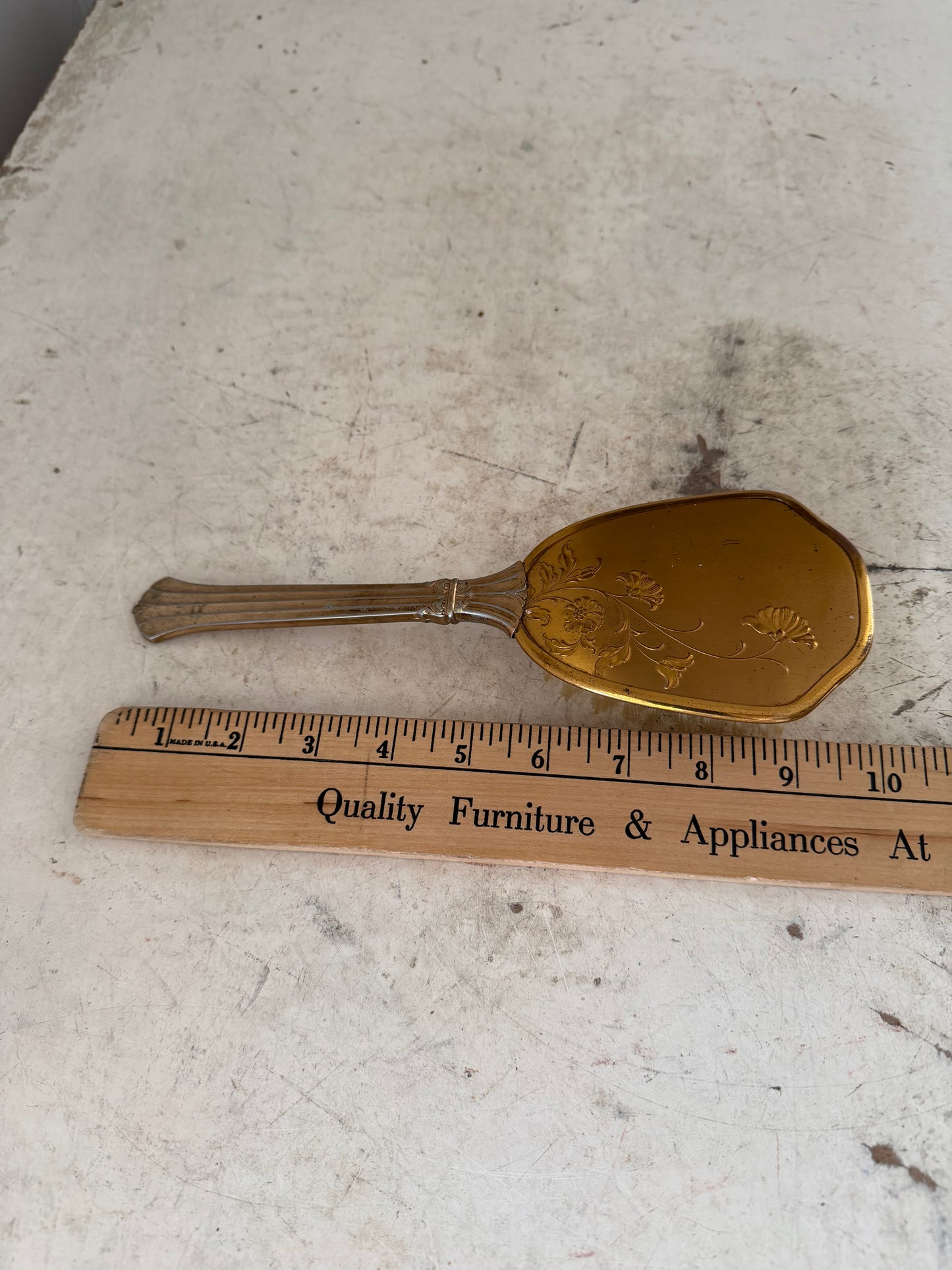 Vintage gold tone hair brush