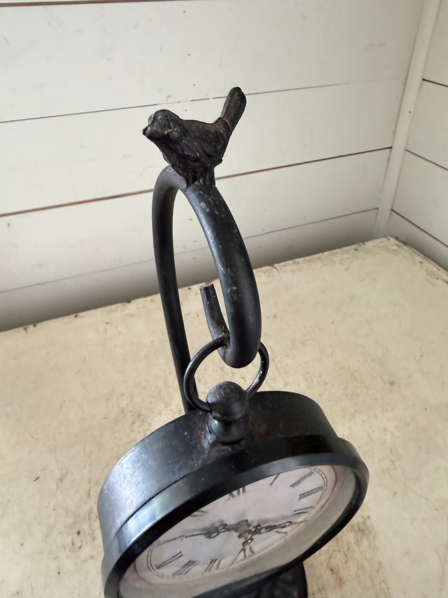 Pocket watch on a stand with a bird on top clock will get makeover