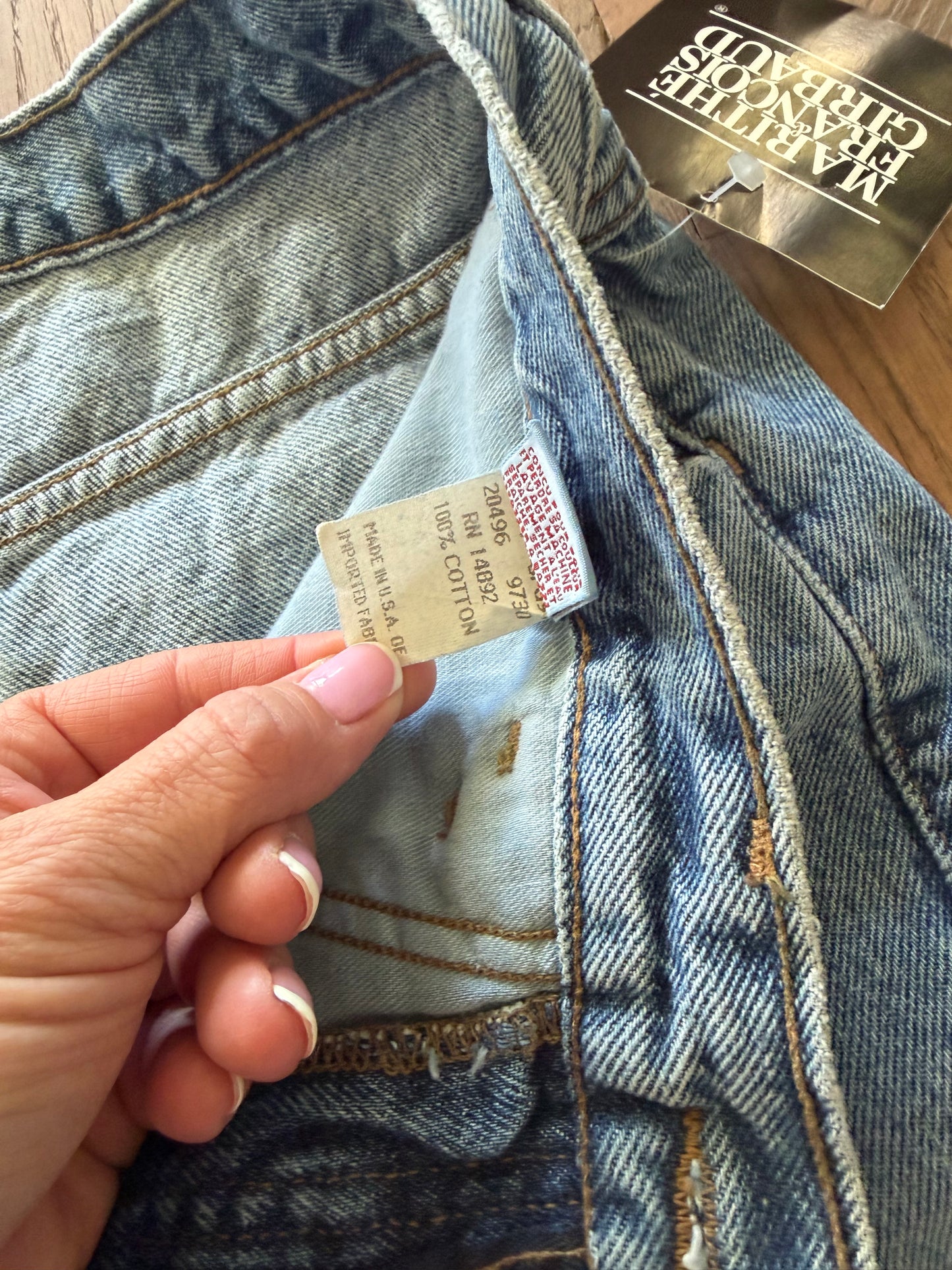 90’s vintage Marithé + François Girbaud denim jeans featuring a black brand hangtag on light-wash material 32 cowboy jean new with tag