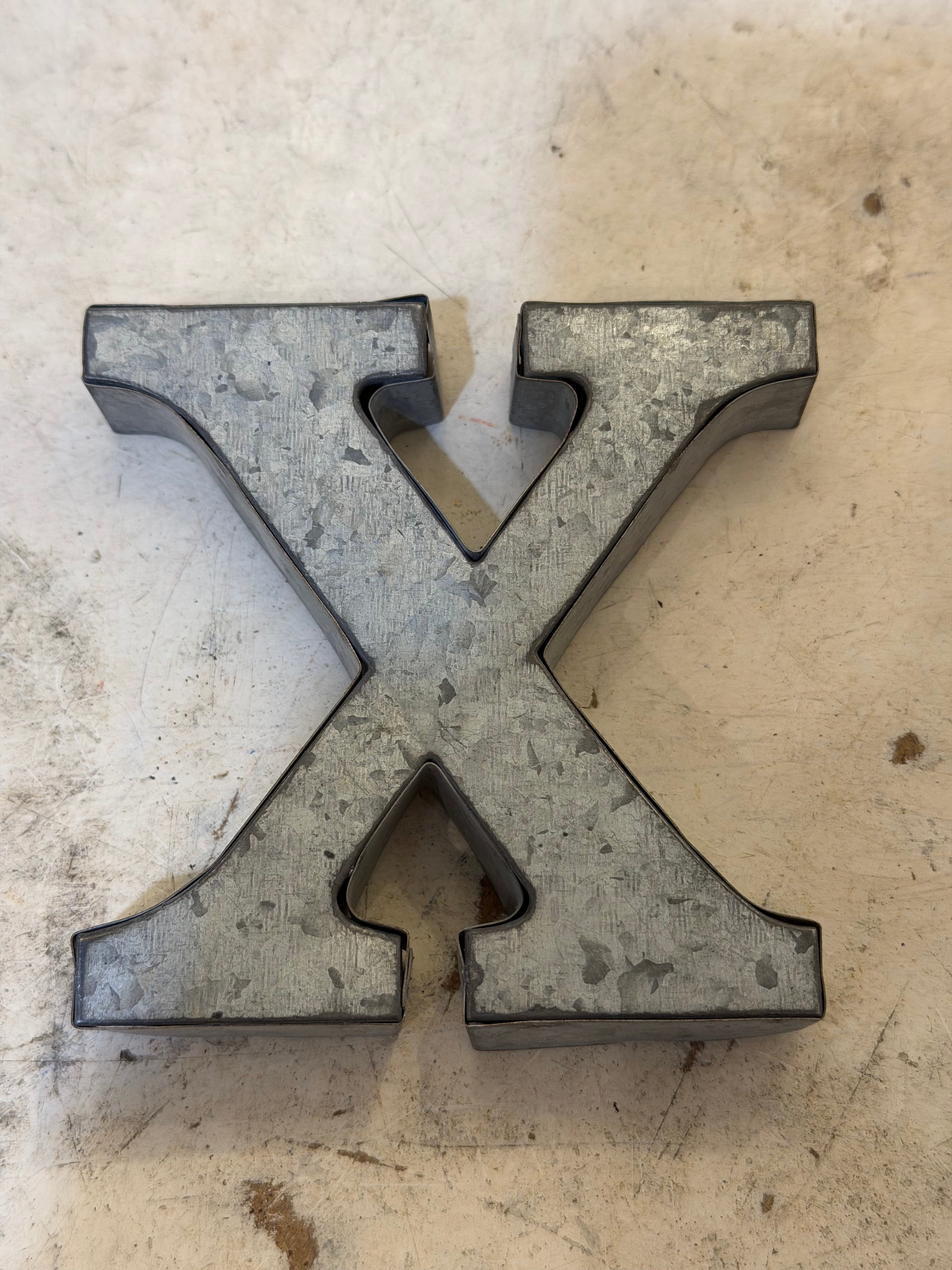 Rustic galvanized, tin letters sold individually Rusted galvanized, tin letters sold individually 3-3/4” - hanging hardware on back