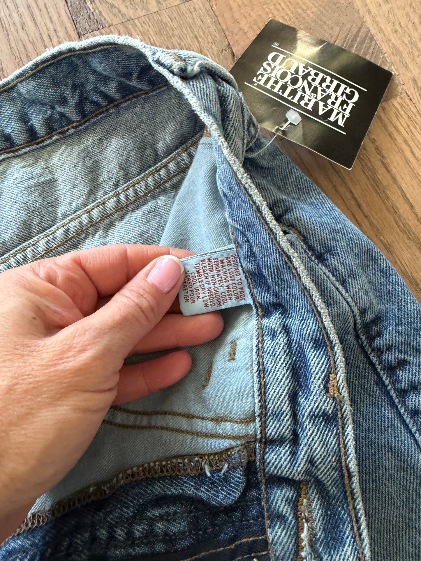 90’s vintage Marithé + François Girbaud denim jeans featuring a black brand hangtag on light-wash material 32 cowboy jean new with tag