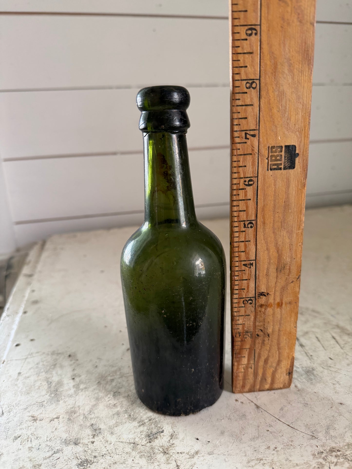 Antique Bottle dark green glass from Greenall Whitley & Co. of Warrington, England