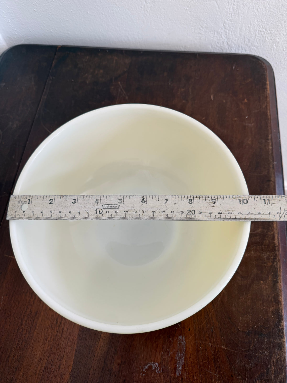 Vintage yellow Pyrex Mixing Bowl with a white interior - Has Some Wear