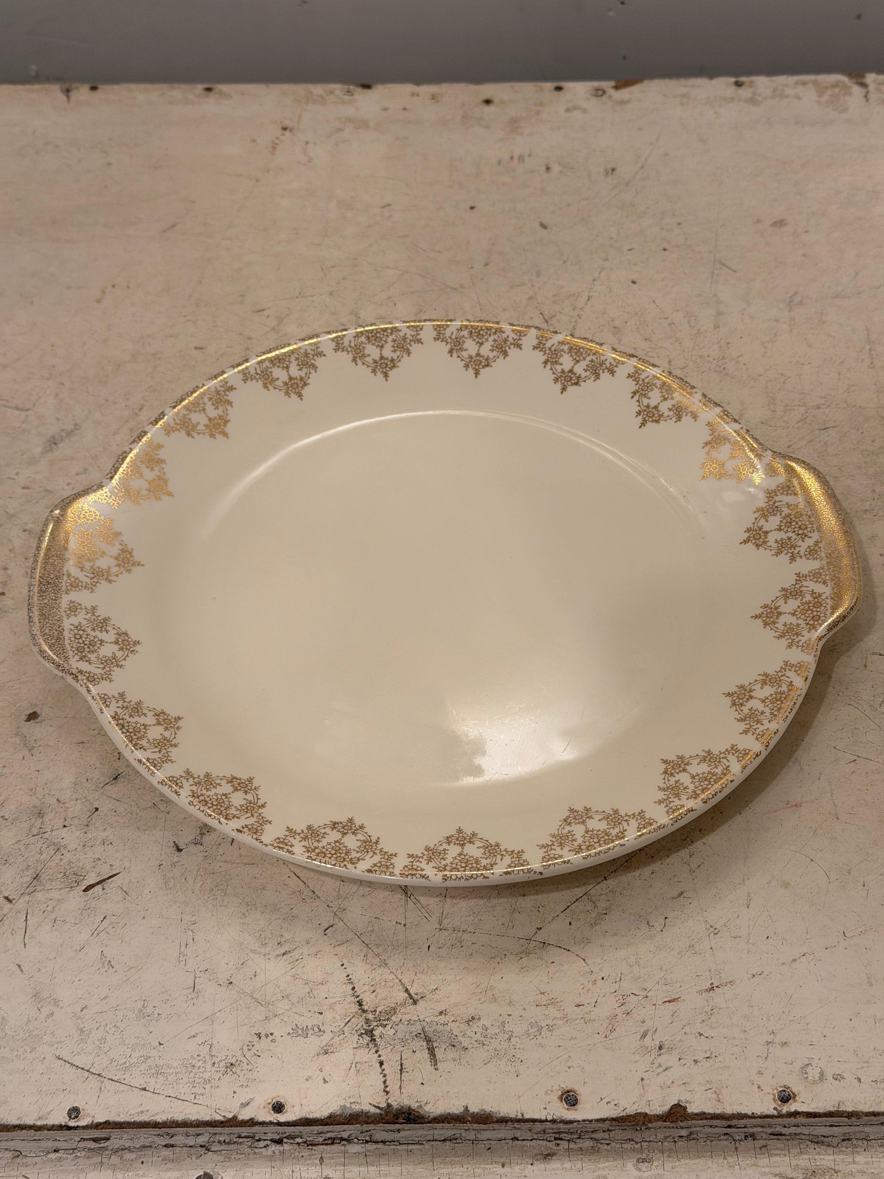 Royal China Inc. "Gold Lace" handled cake plate/oval platter with 22k gold trim with chip