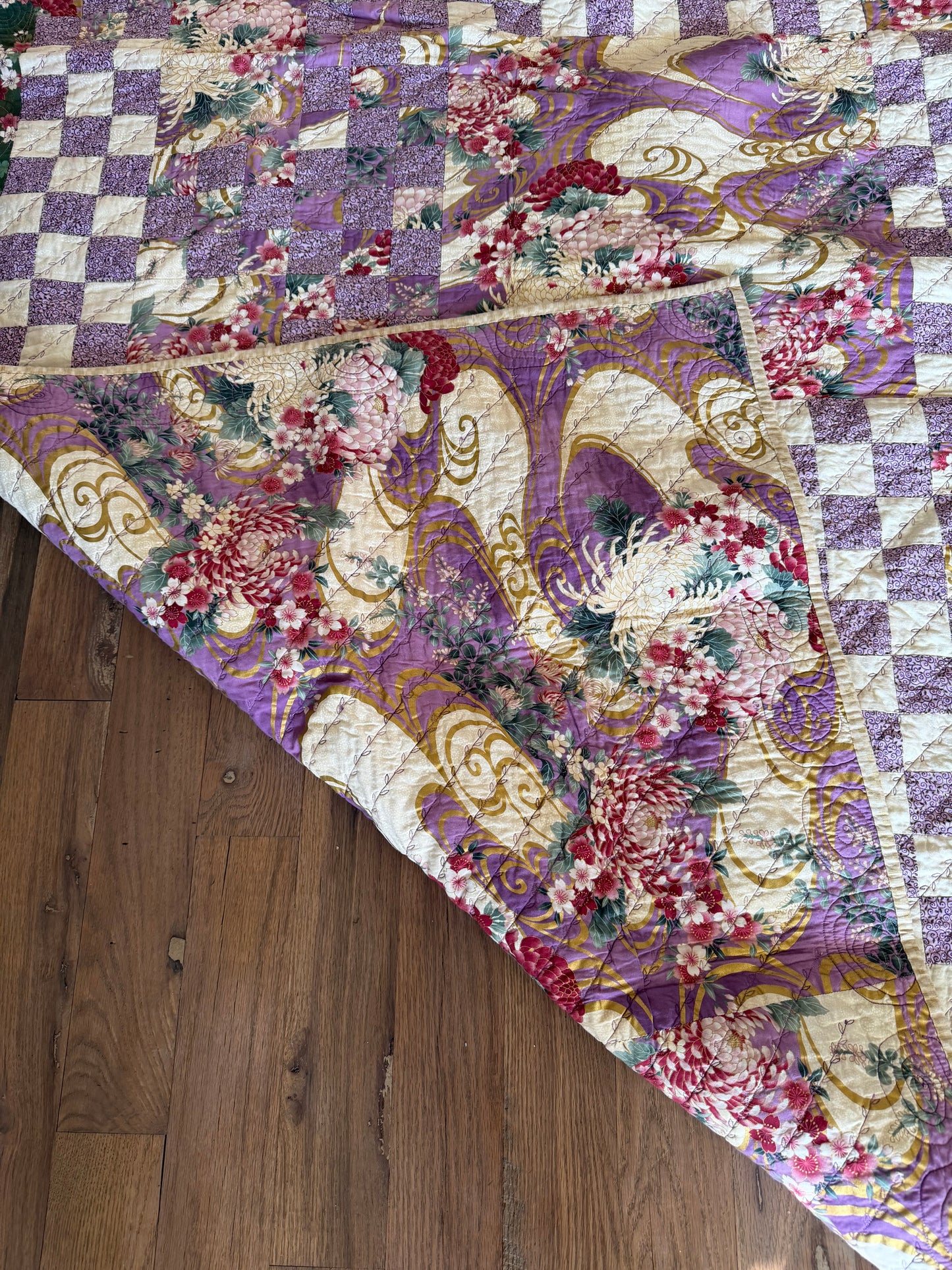 Handmade Quilt with a Japanese-inspired fabric with chrysanthemum and flowing wave patterns