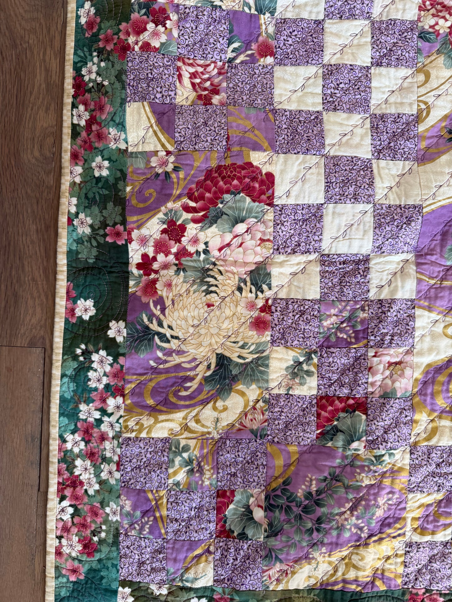Handmade Quilt with a Japanese-inspired fabric with chrysanthemum and flowing wave patterns