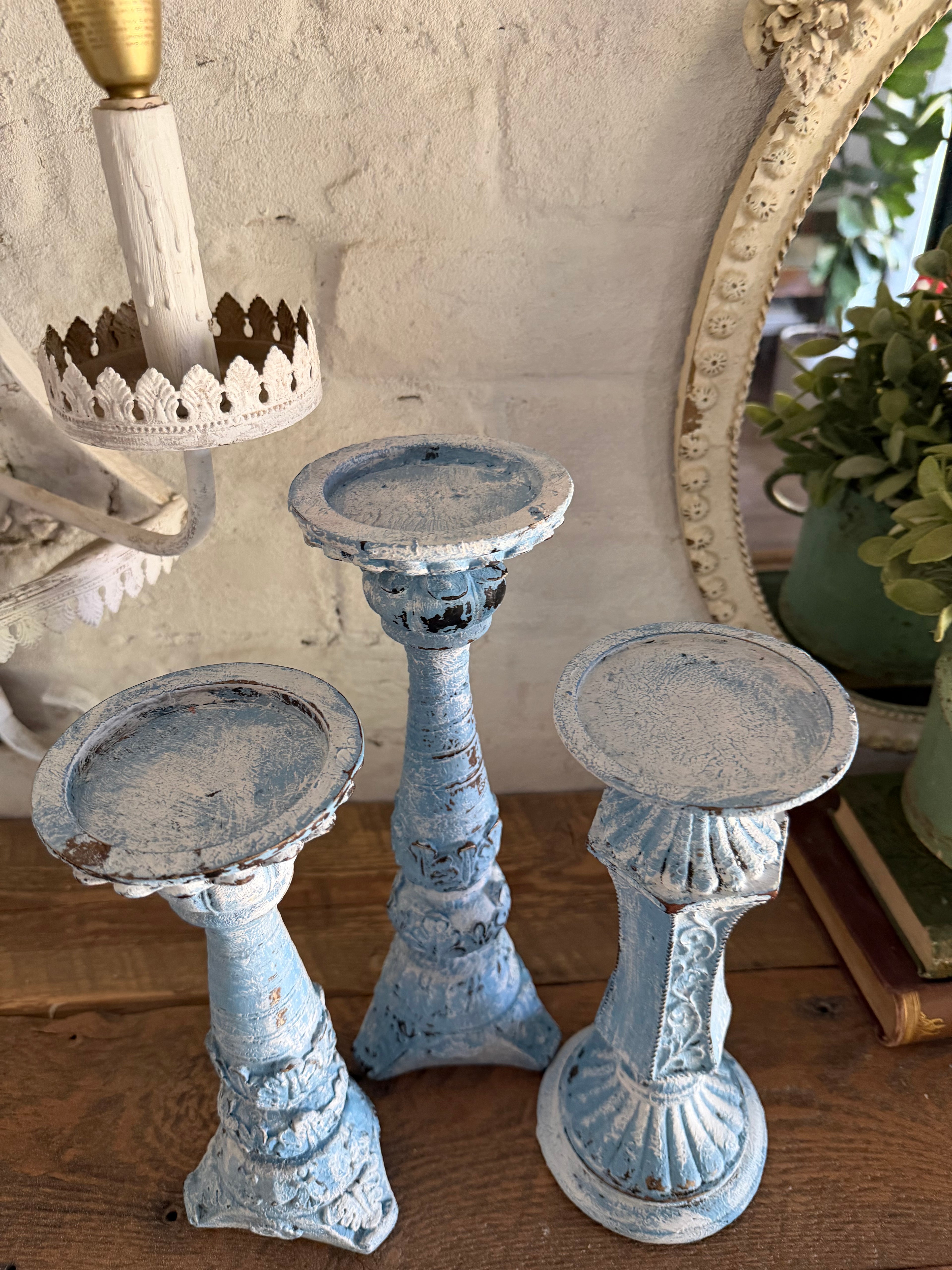 Set of three chippy French country candlesticks