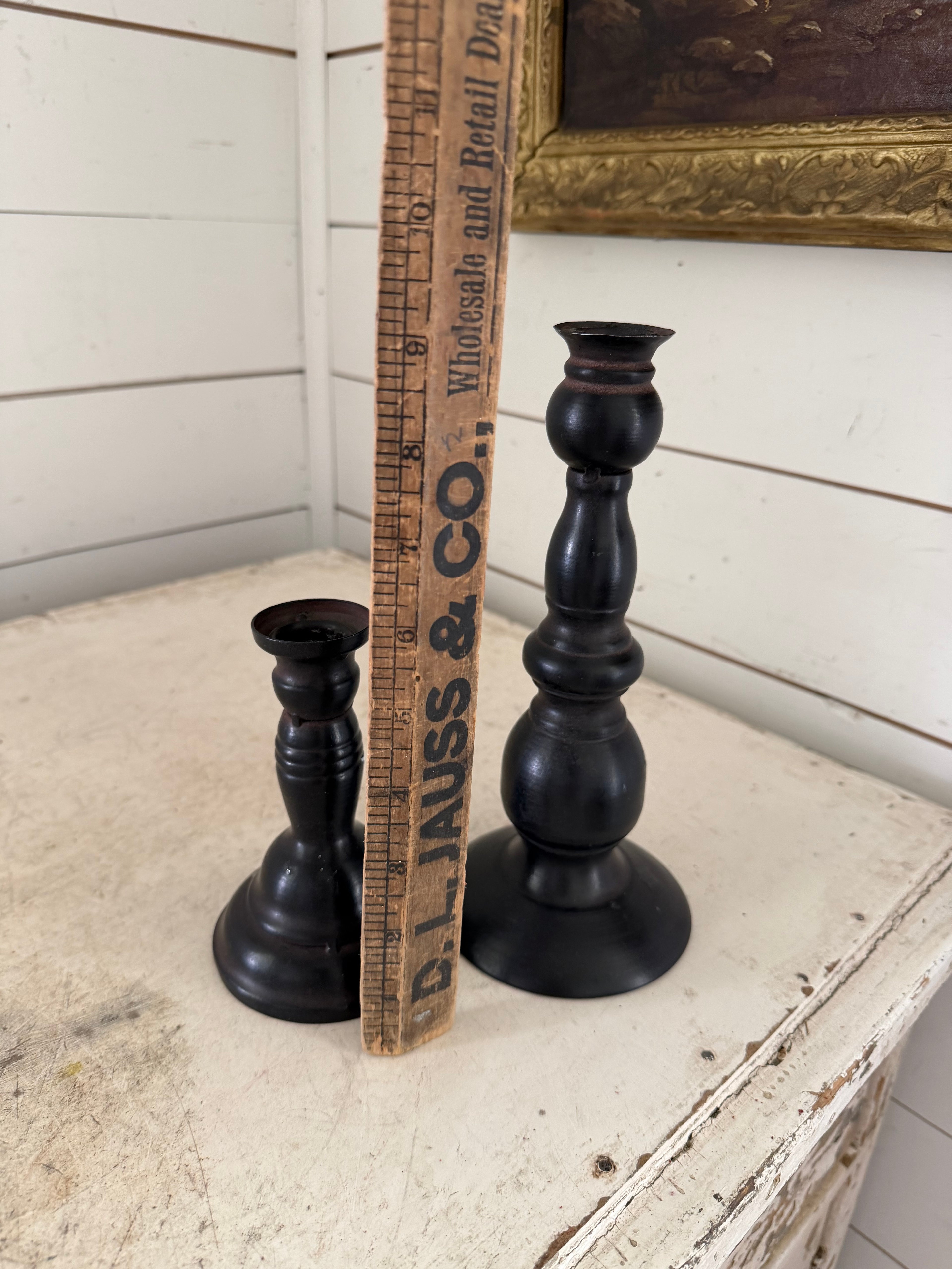 Set of black metal candlesticks
