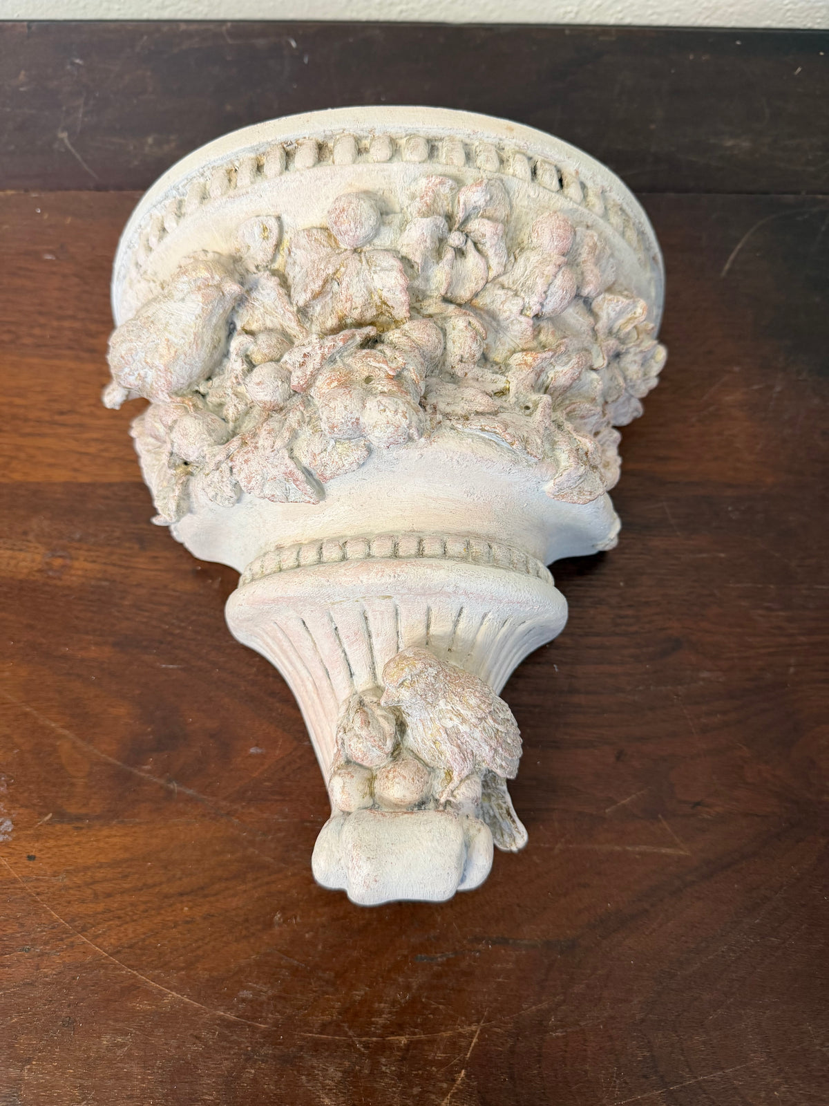 Plaster wall, sconces with flowers and birds will get makeover