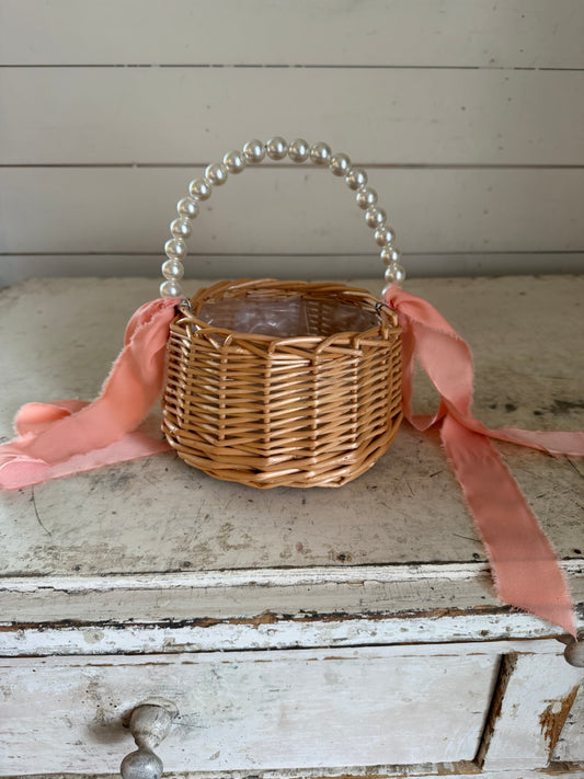 Flower girl basket with faux pearl handle with pink ribbon