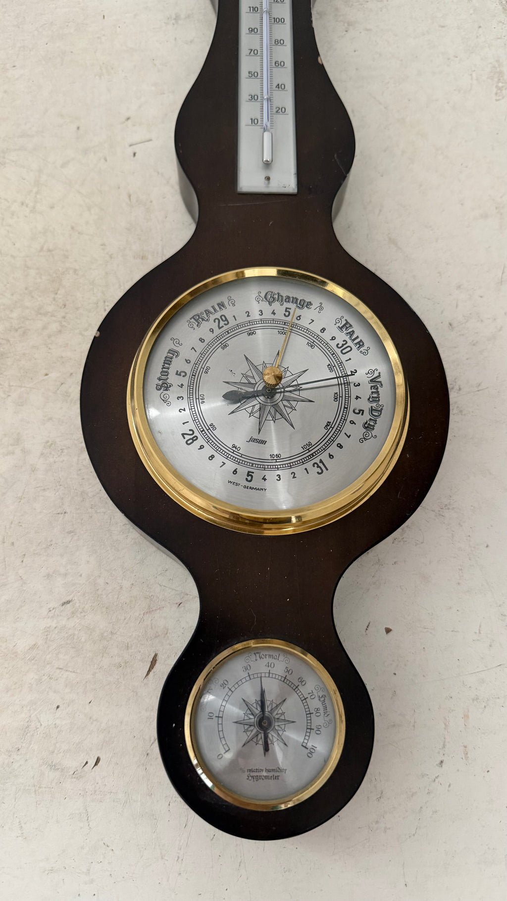 vintage German-made banjo-style weather station features a dark mahogany wood base, a barometer, a thermometer, and a hygrometer as is