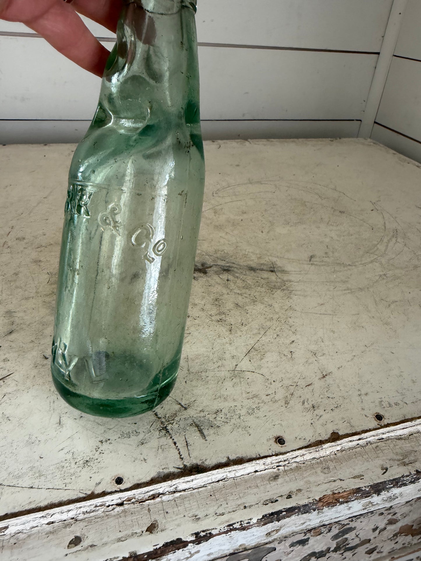 Antique glass Codd soda bottle