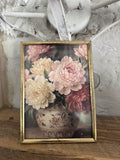 Brass frame with floral art 7”