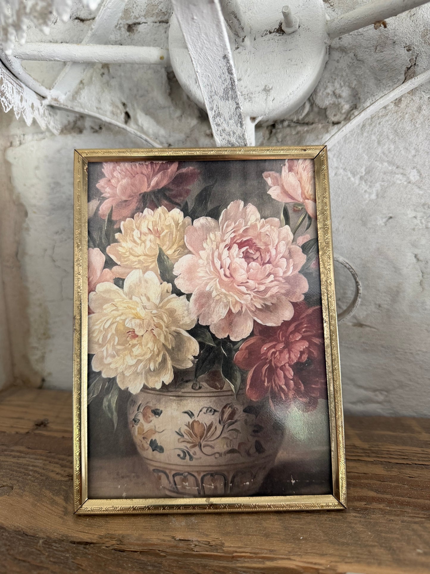 Brass frame with floral art 7”