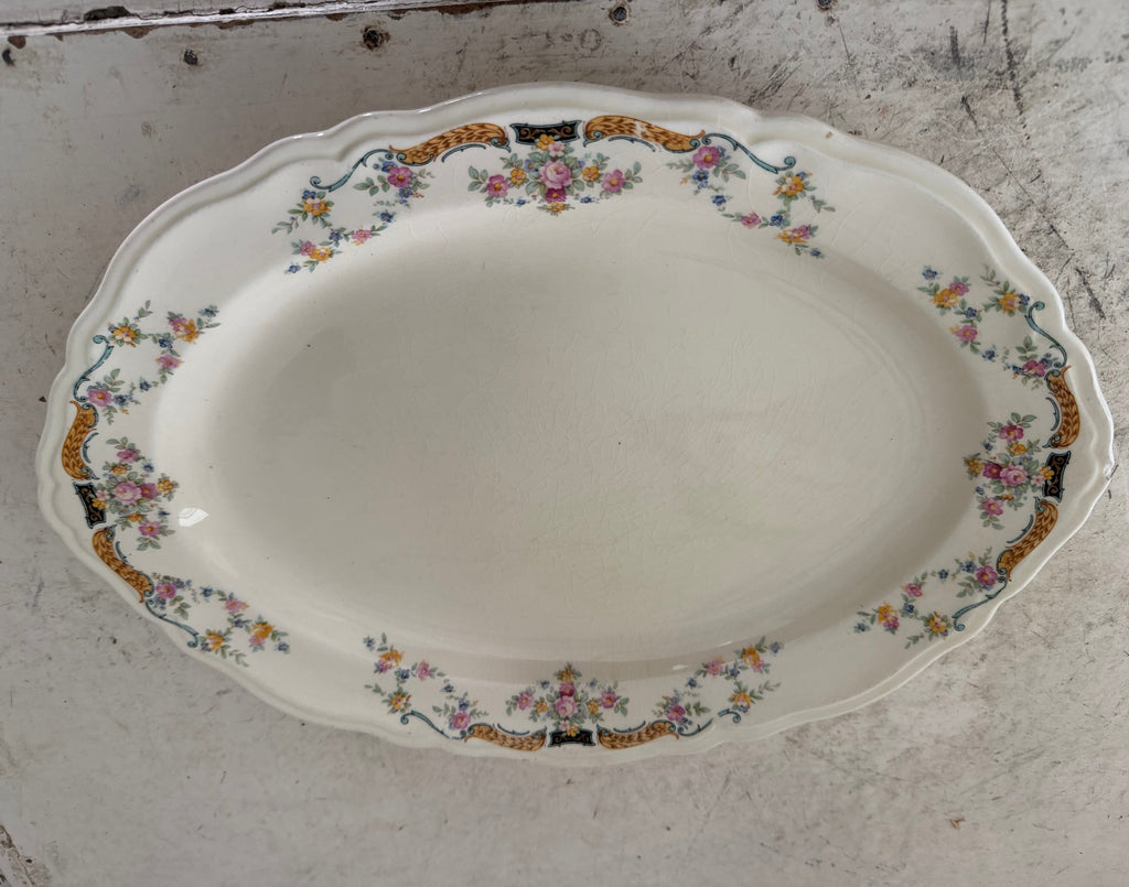 Vintage Edwin M. Knowles China Co Platter has chip