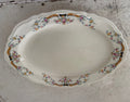 Vintage Edwin M. Knowles China Co Platter has chip