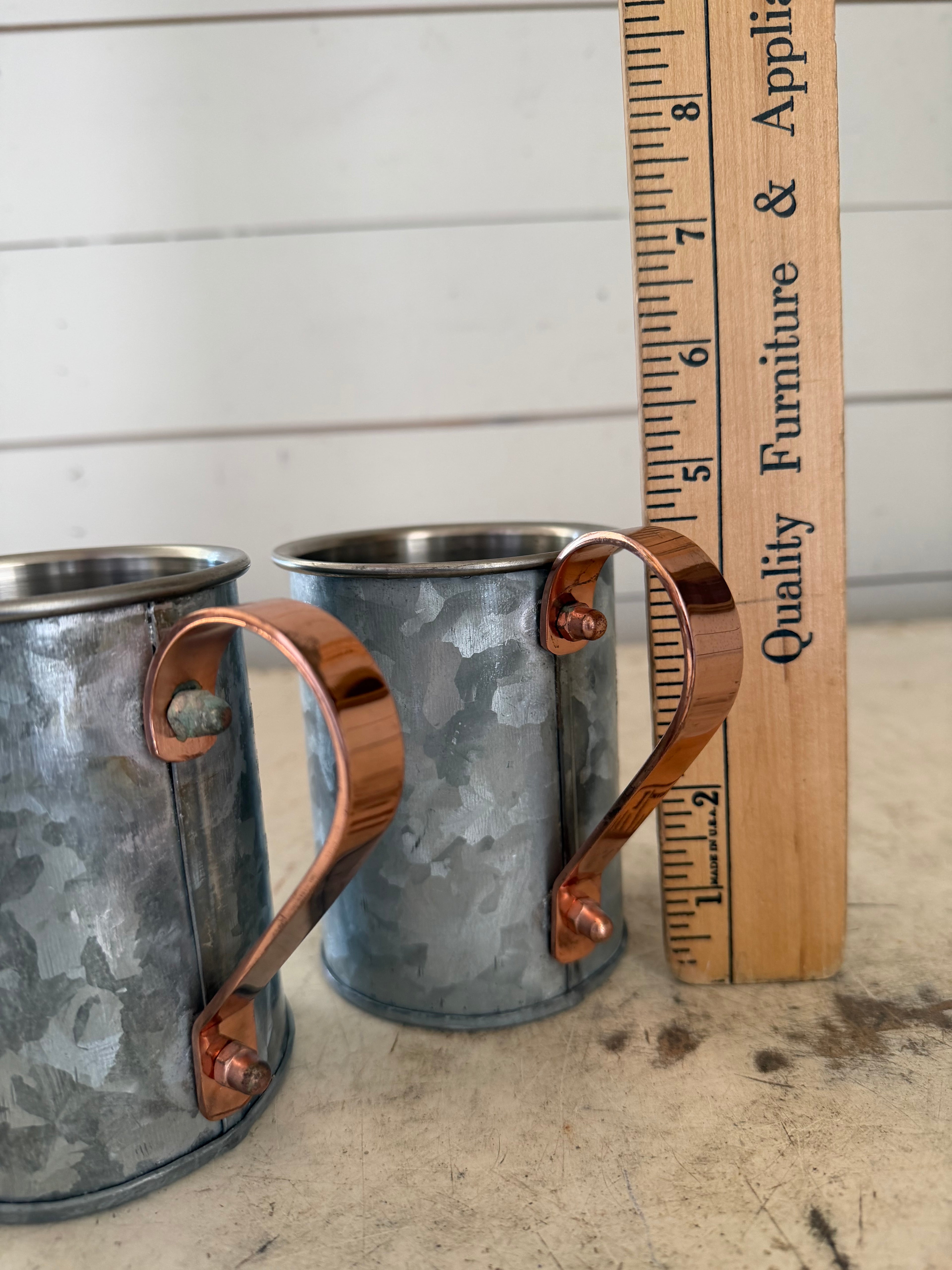 Weighted cup with copper handle