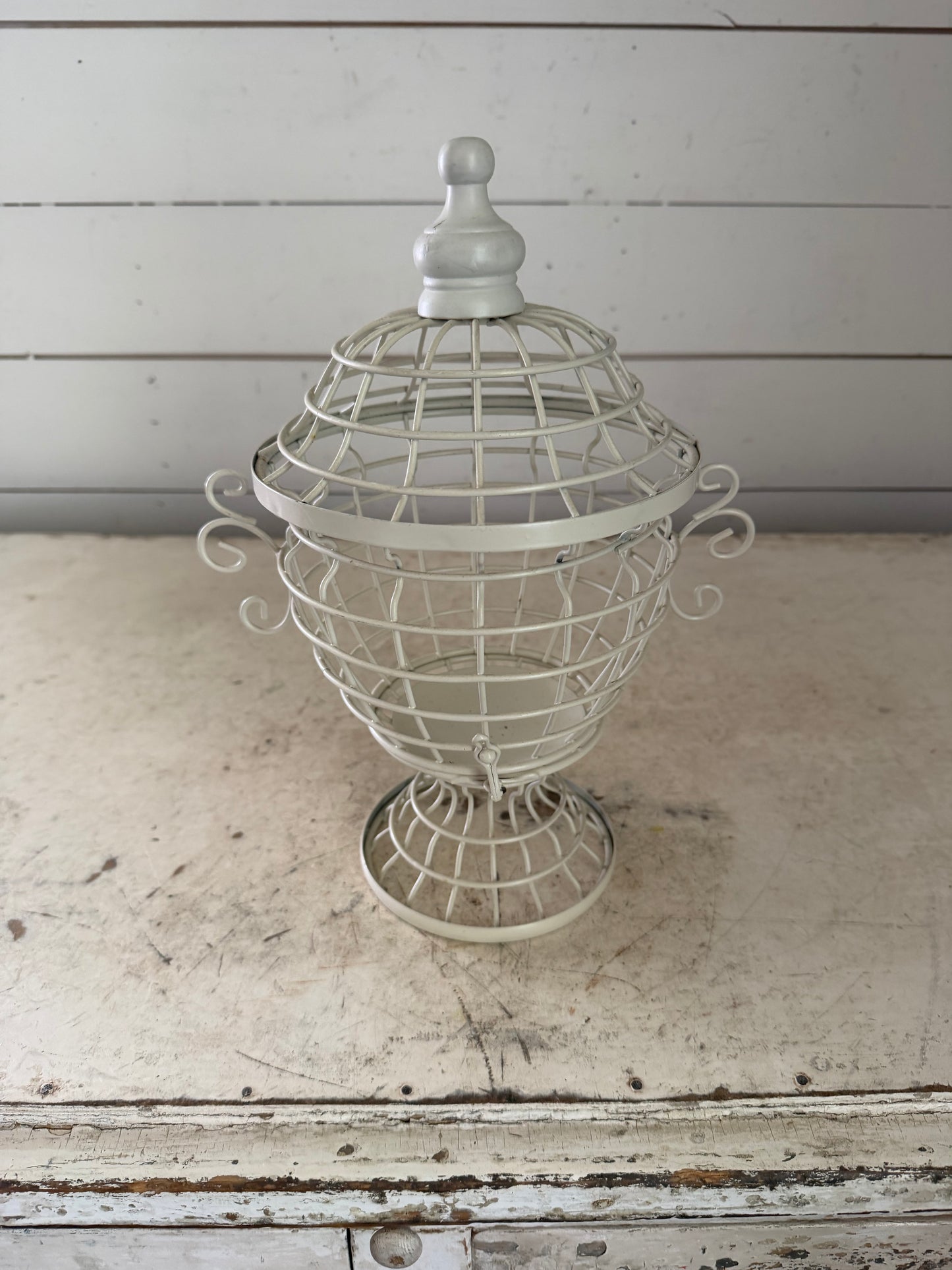White decorative birdhouse style urn with lid