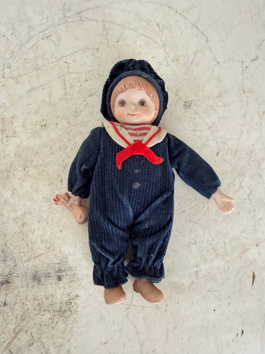 Vintage porcelain doll with sailor outfit