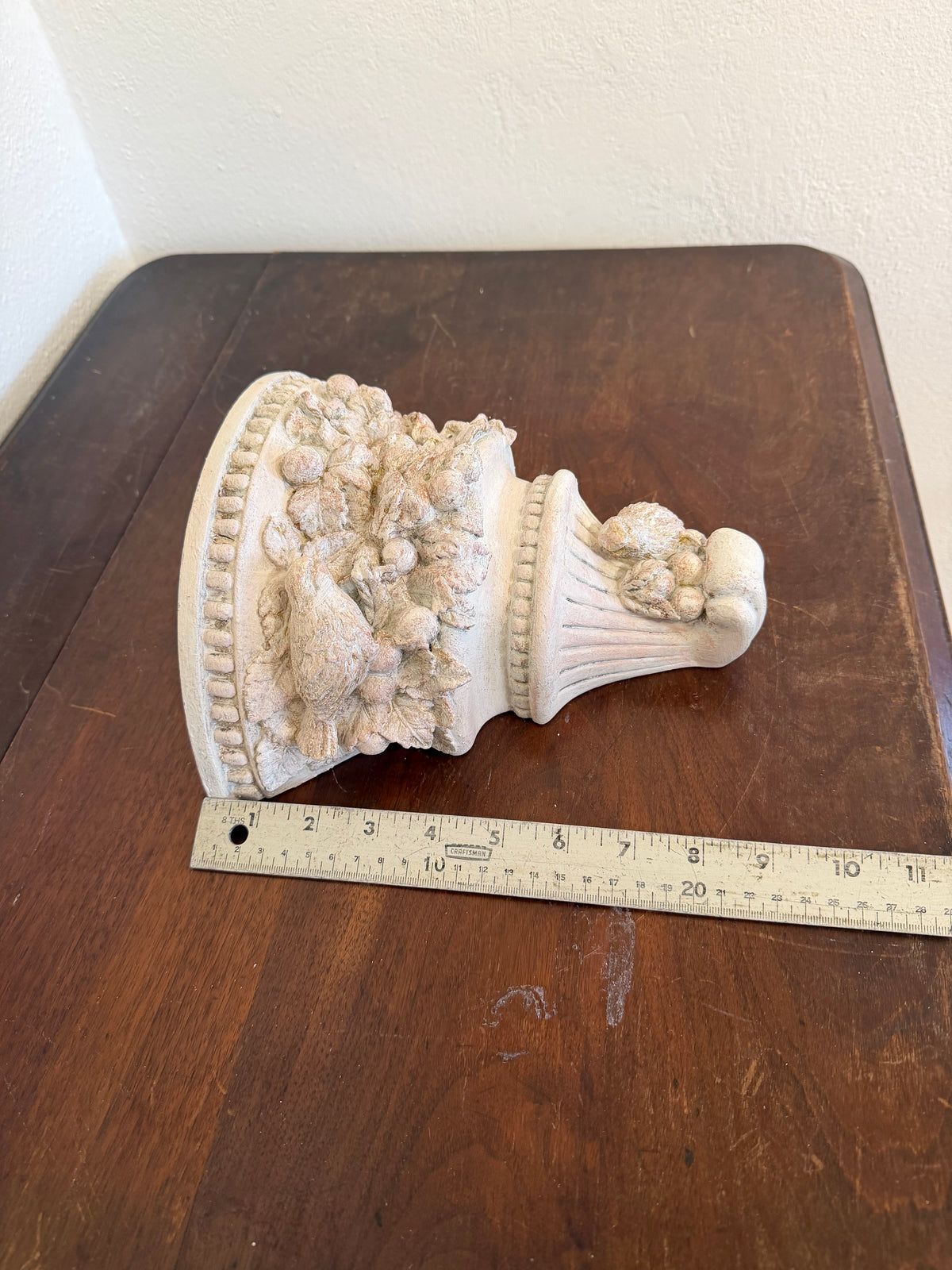 Plaster wall, sconces with flowers and birds will get makeover