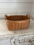 Woven basket with handles