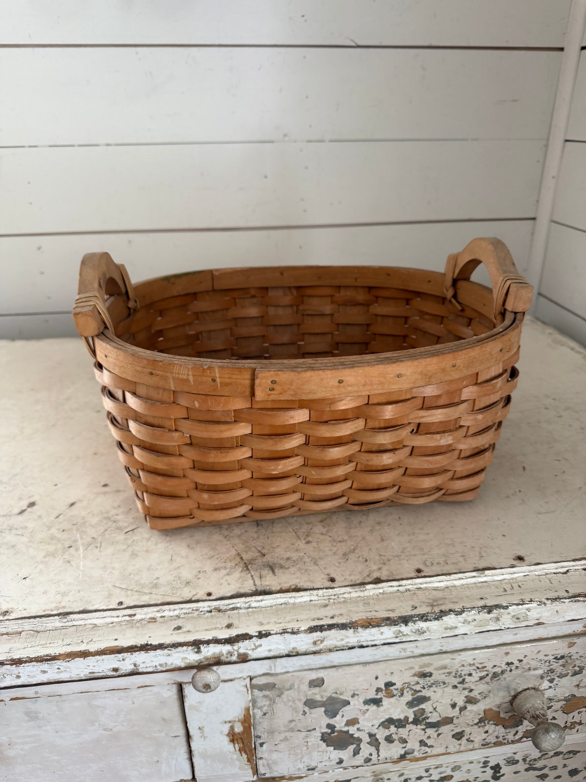Woven basket with handles