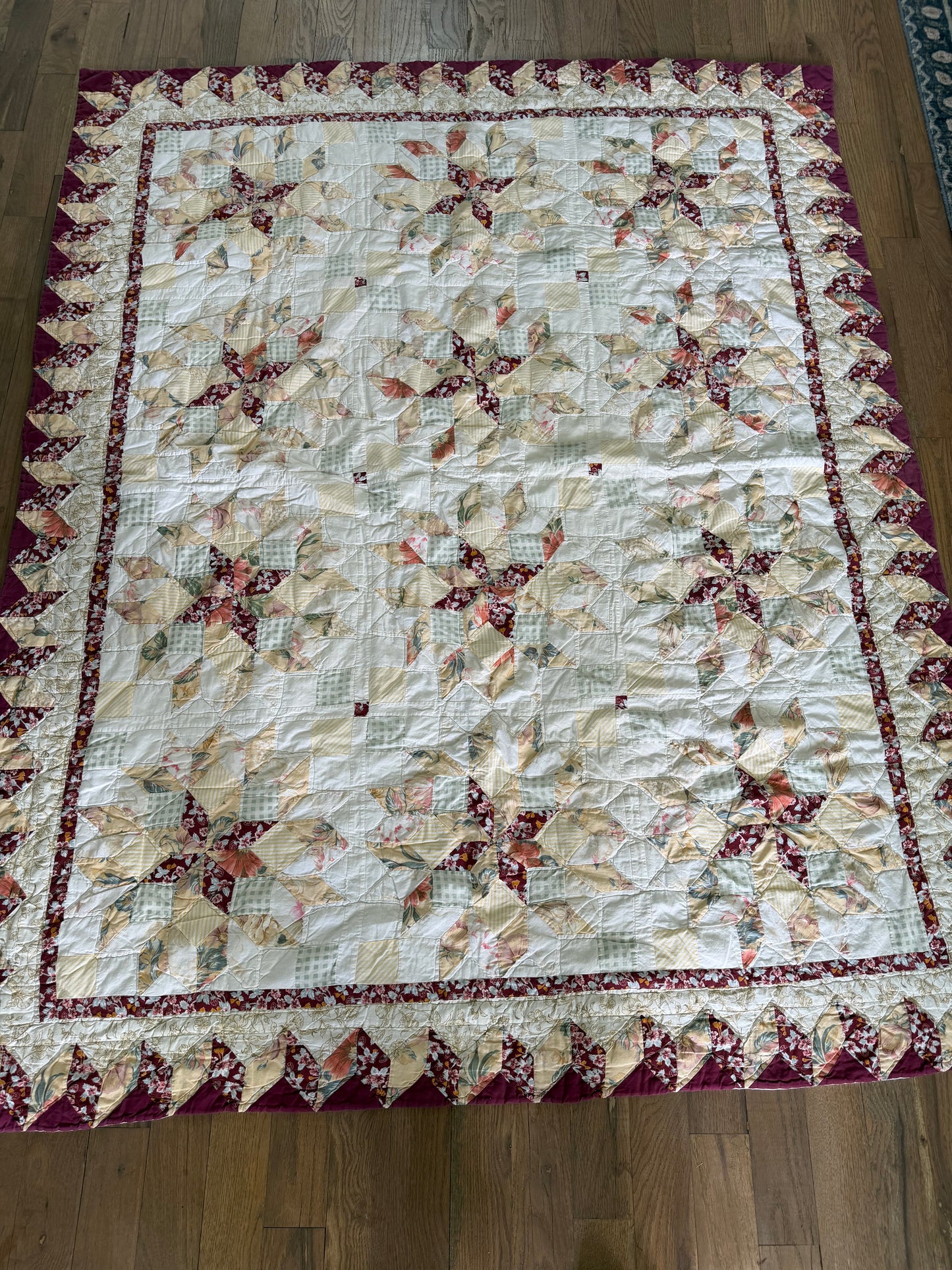handmade quilt featuring a repeating star pattern full