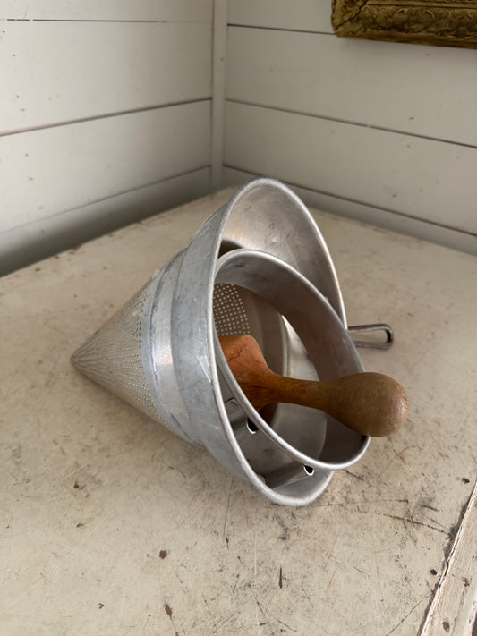 Vintage sieve with pestal