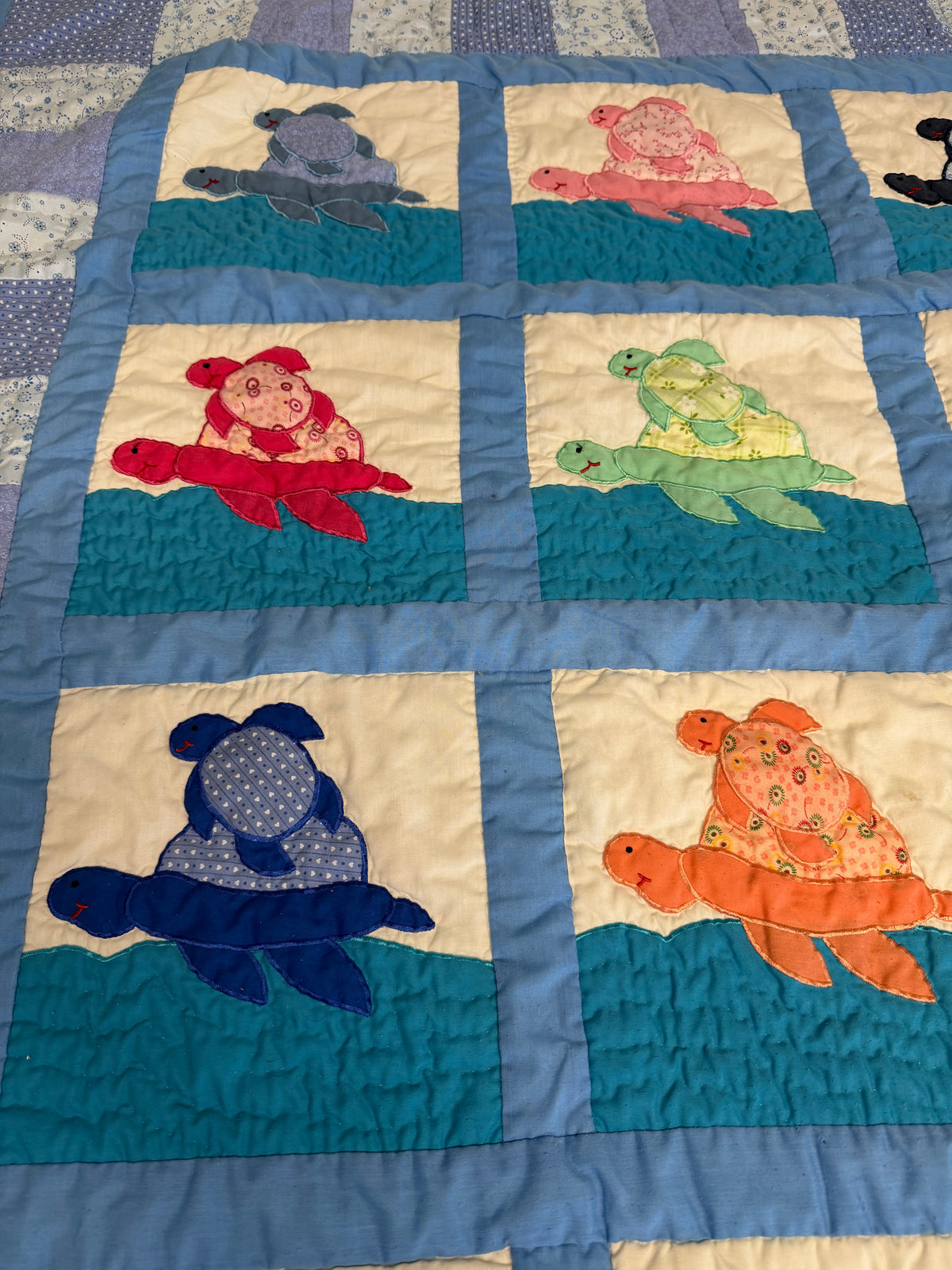 Handcrafted sea turtle-themed baby quilt