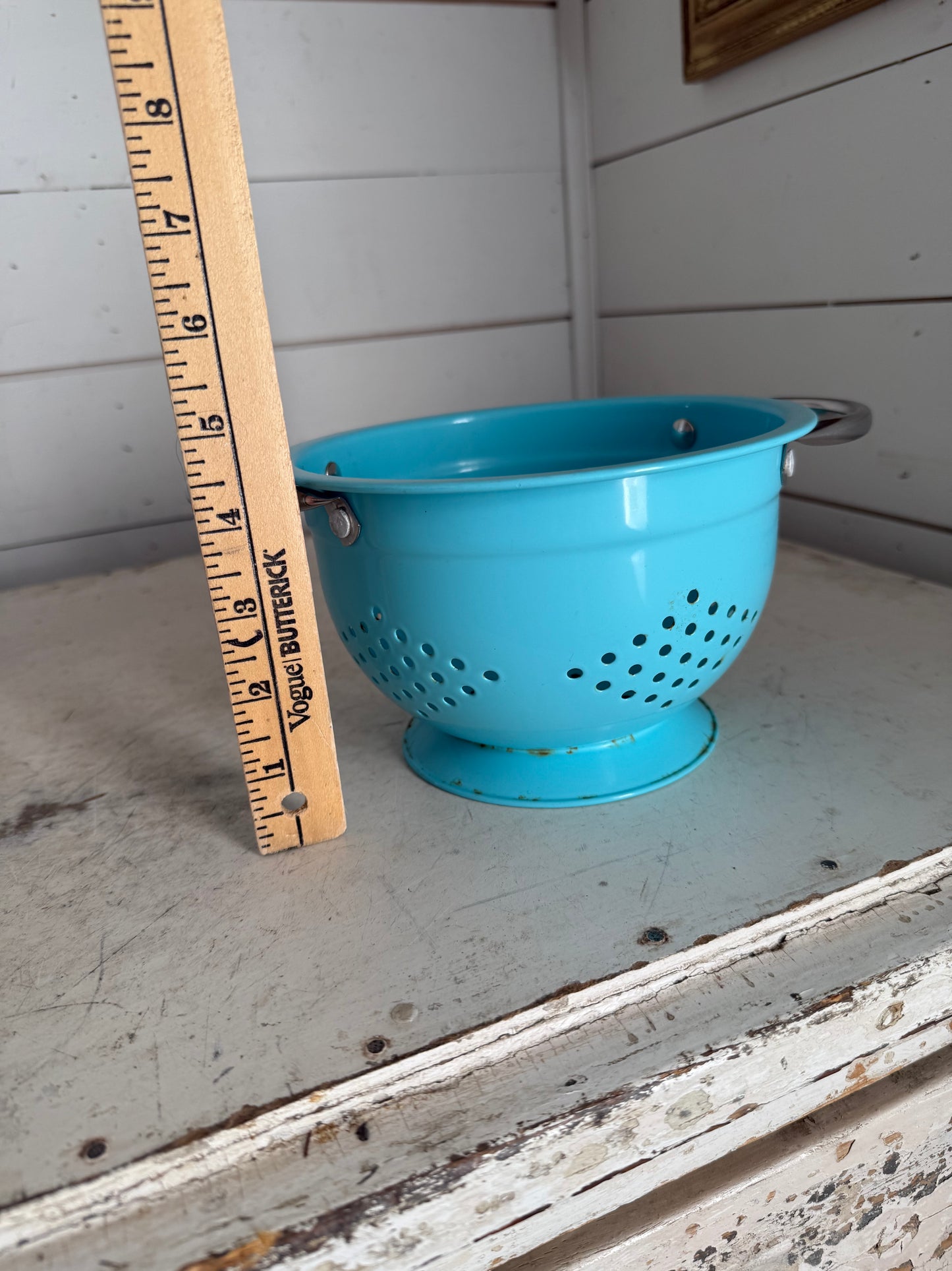 Medium teal colander with a little rust