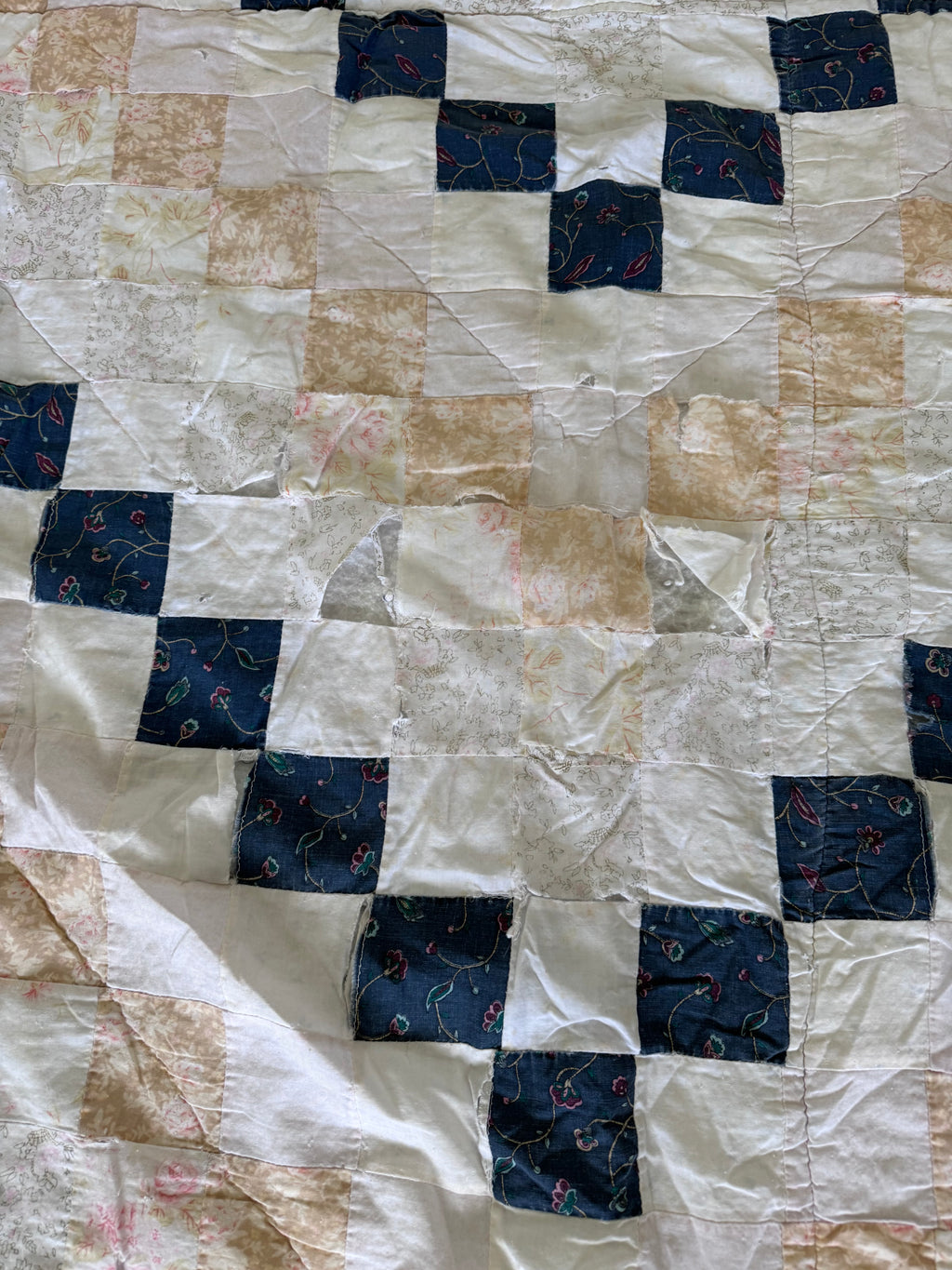 Hand made quilt with diamond pattern - has rips
