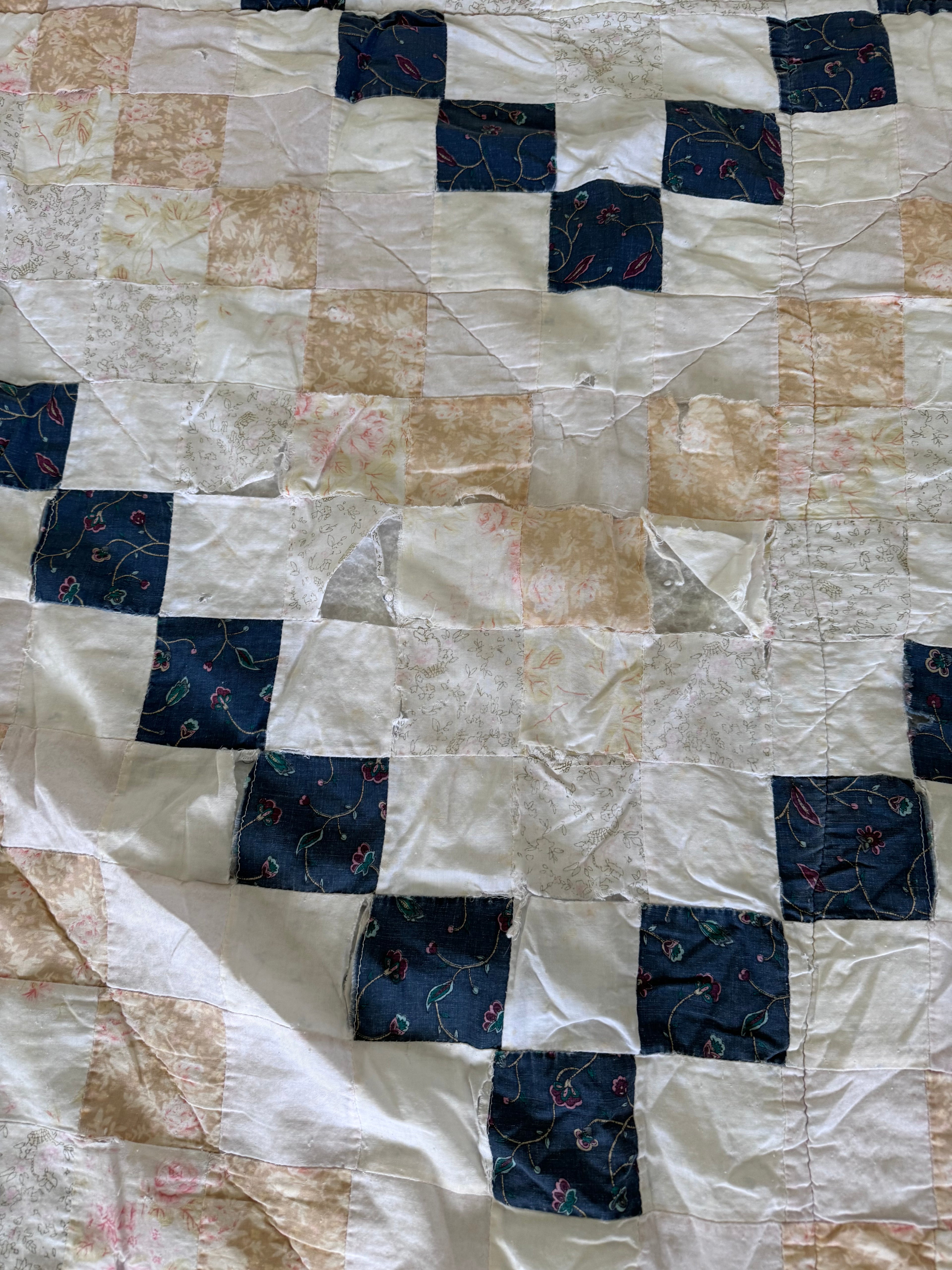 Hand made quilt with diamond pattern - has rips